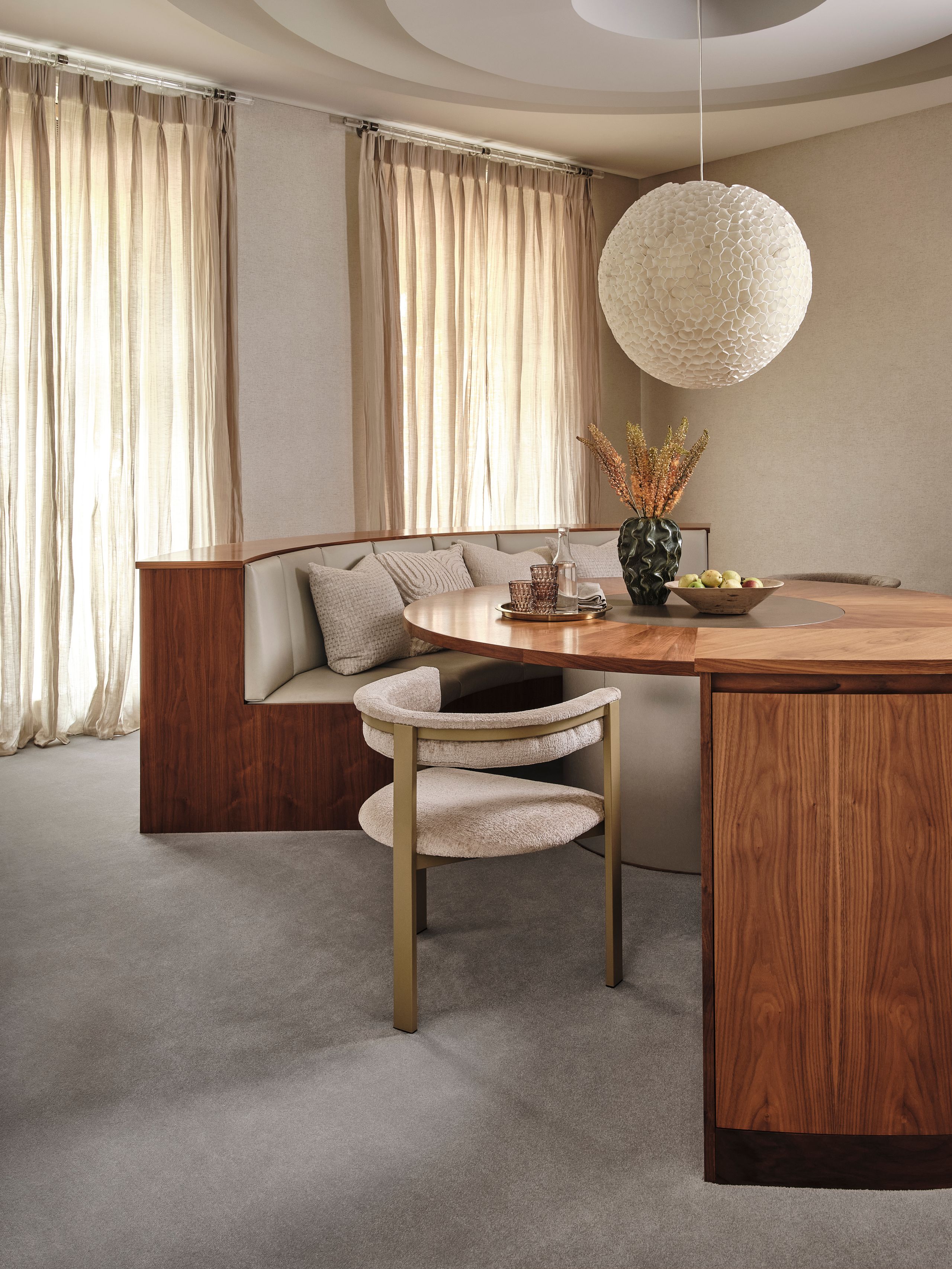 Image may contain: Indoors, Interior Design, Furniture, Table, Home Decor, Chair, Dining Table, Architecture, and Building