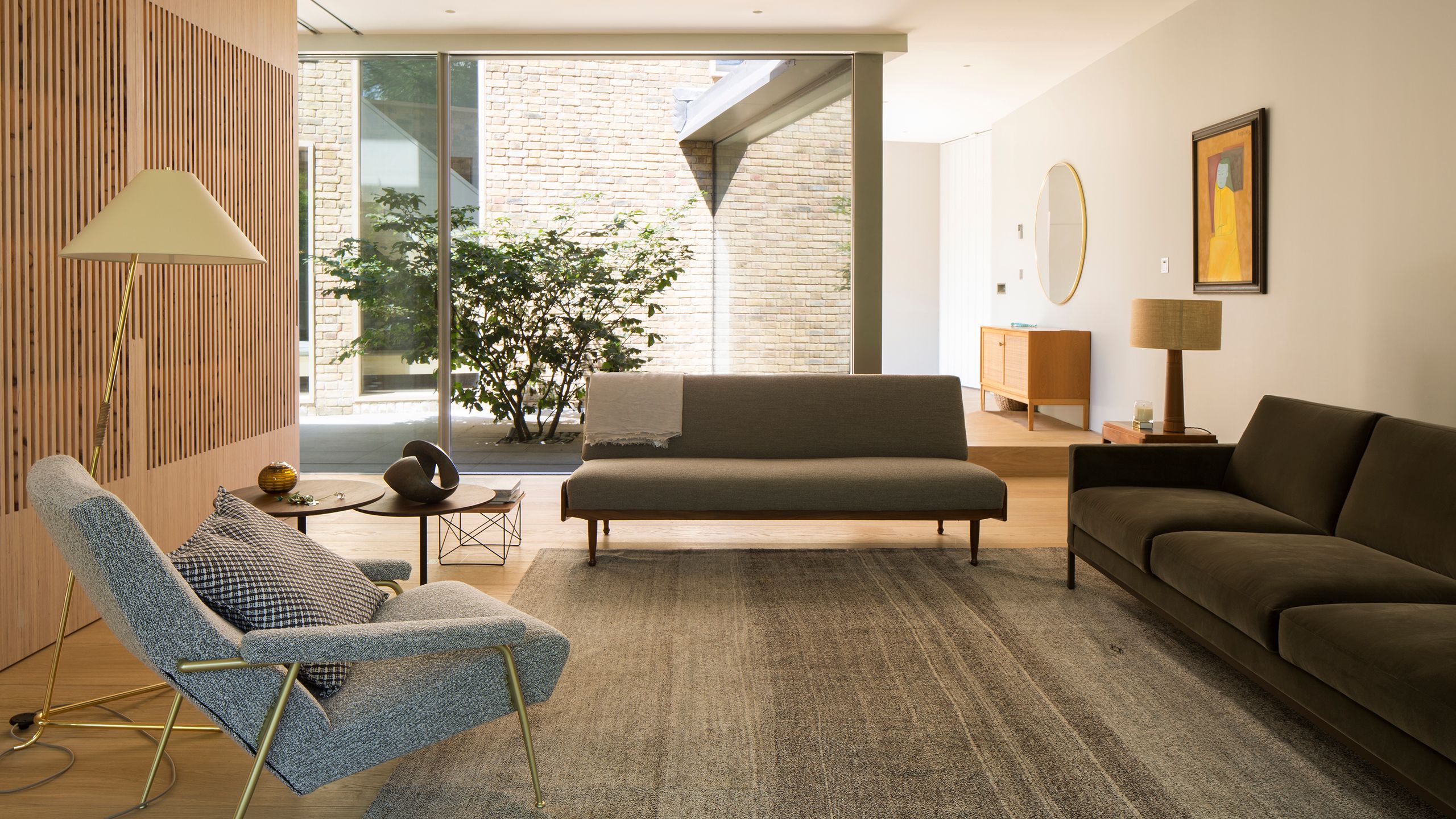 Image may contain: Lamp, Home Decor, Indoors, Interior Design, Couch, Furniture, Art, Painting, Chair, and Architecture