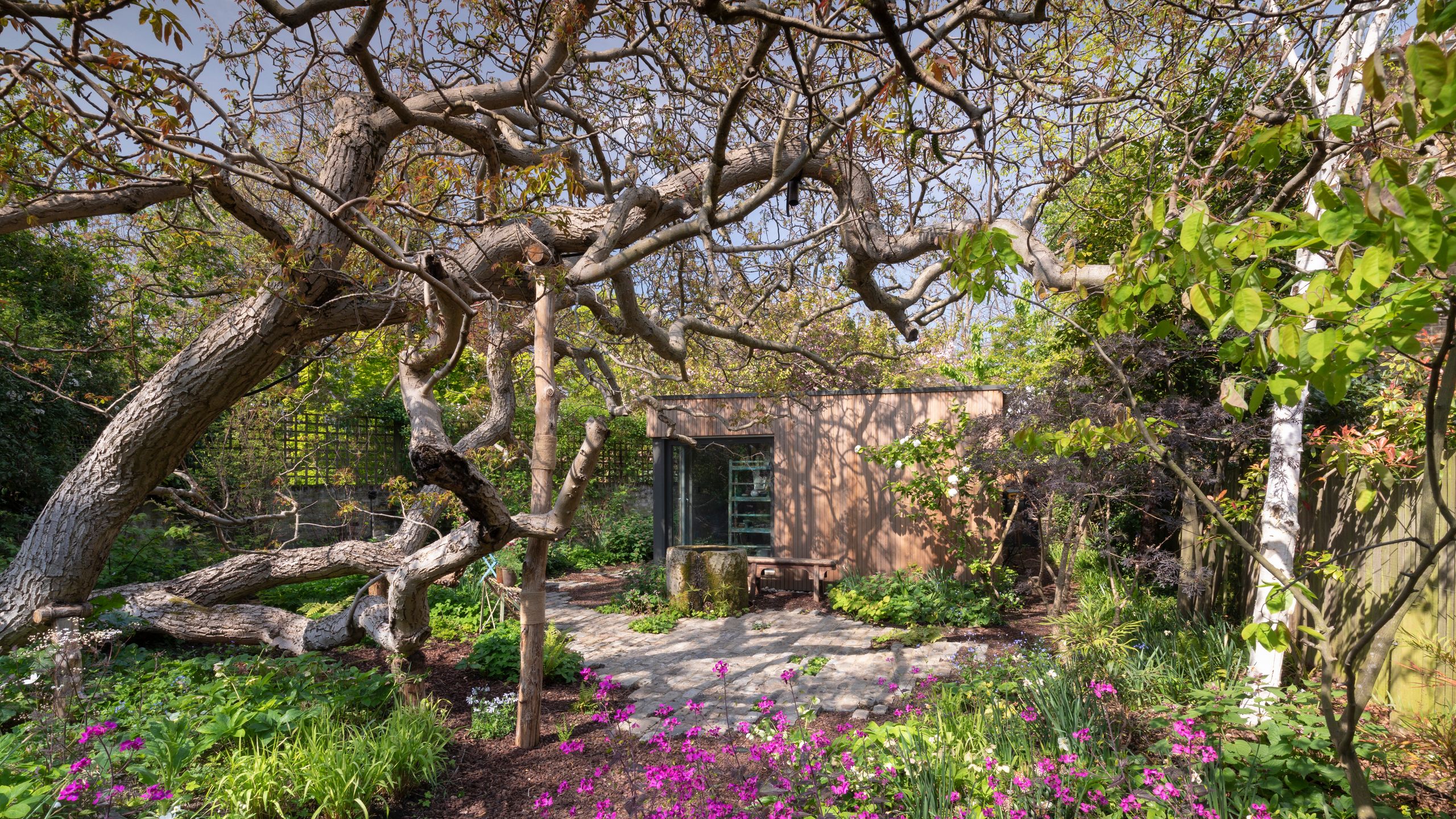 Image may contain: Architecture, Building, Cottage, House, Housing, Plant, Vegetation, Garden, Nature, Outdoors, and Tree