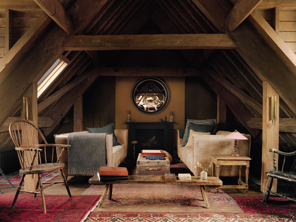 Image may contain Architecture Building House Housing Indoors Loft Room Chair Furniture Lamp Attic and Home Decor