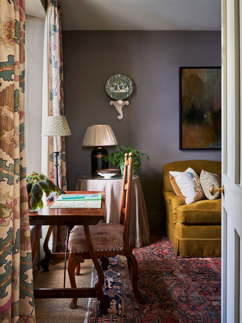 Image may contain: Lamp, Architecture, Building, Furniture, Indoors, Living Room, Room, Home Decor, and Couch