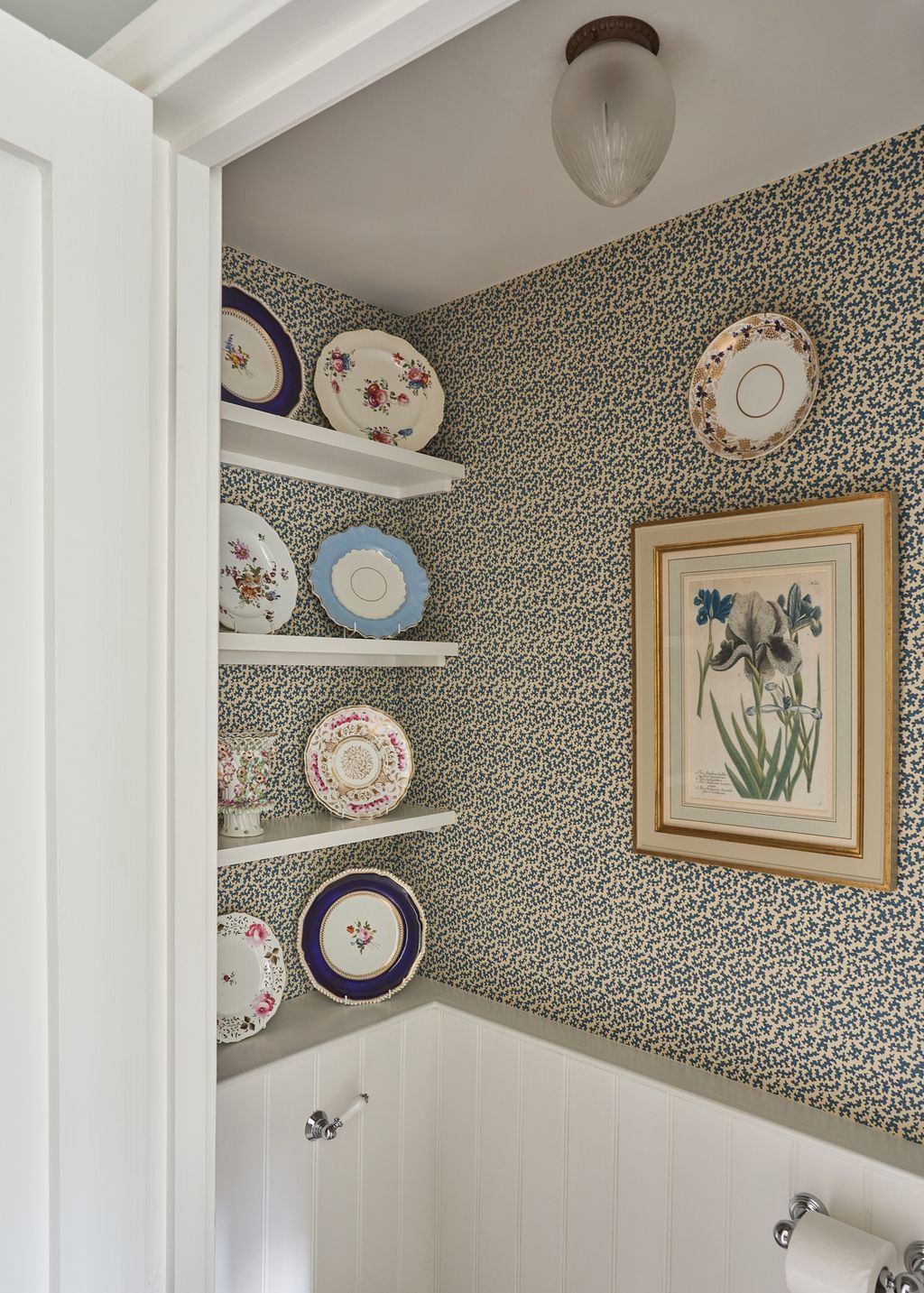 Image may contain Indoors Interior Design Art Painting Plate Porcelain Pottery Furniture and Plate Rack