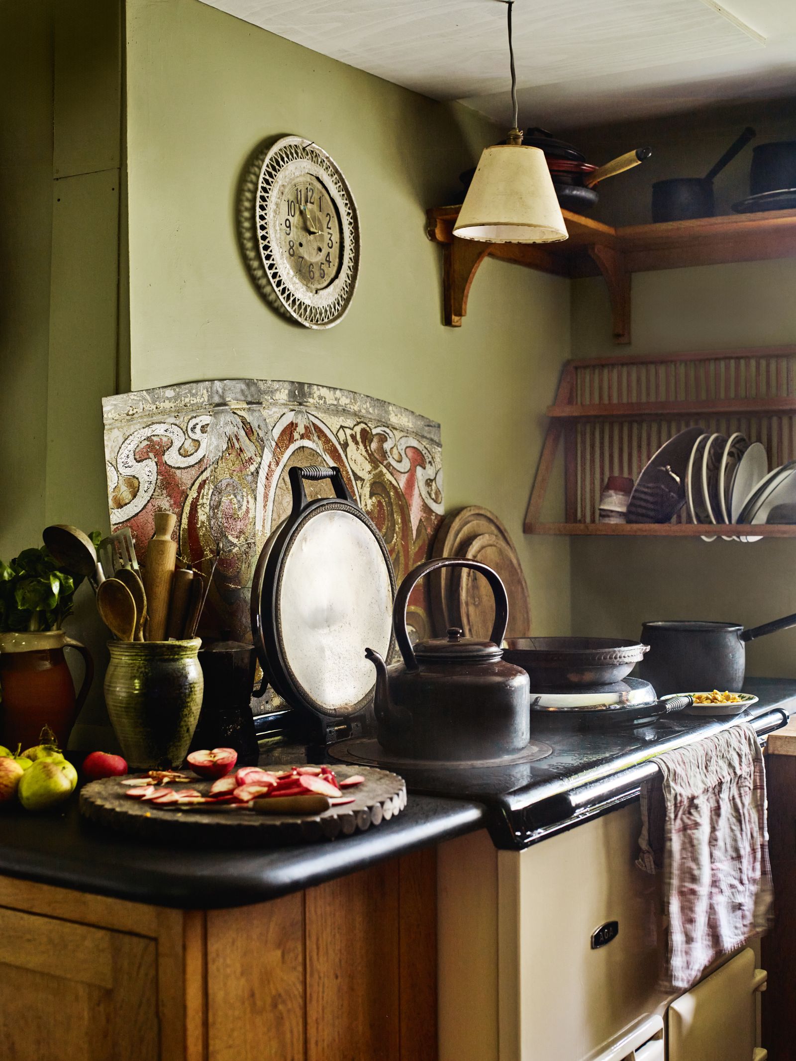 Image may contain Lamp Indoors Kitchen Plate Cup Clothing Hat and Cooktop