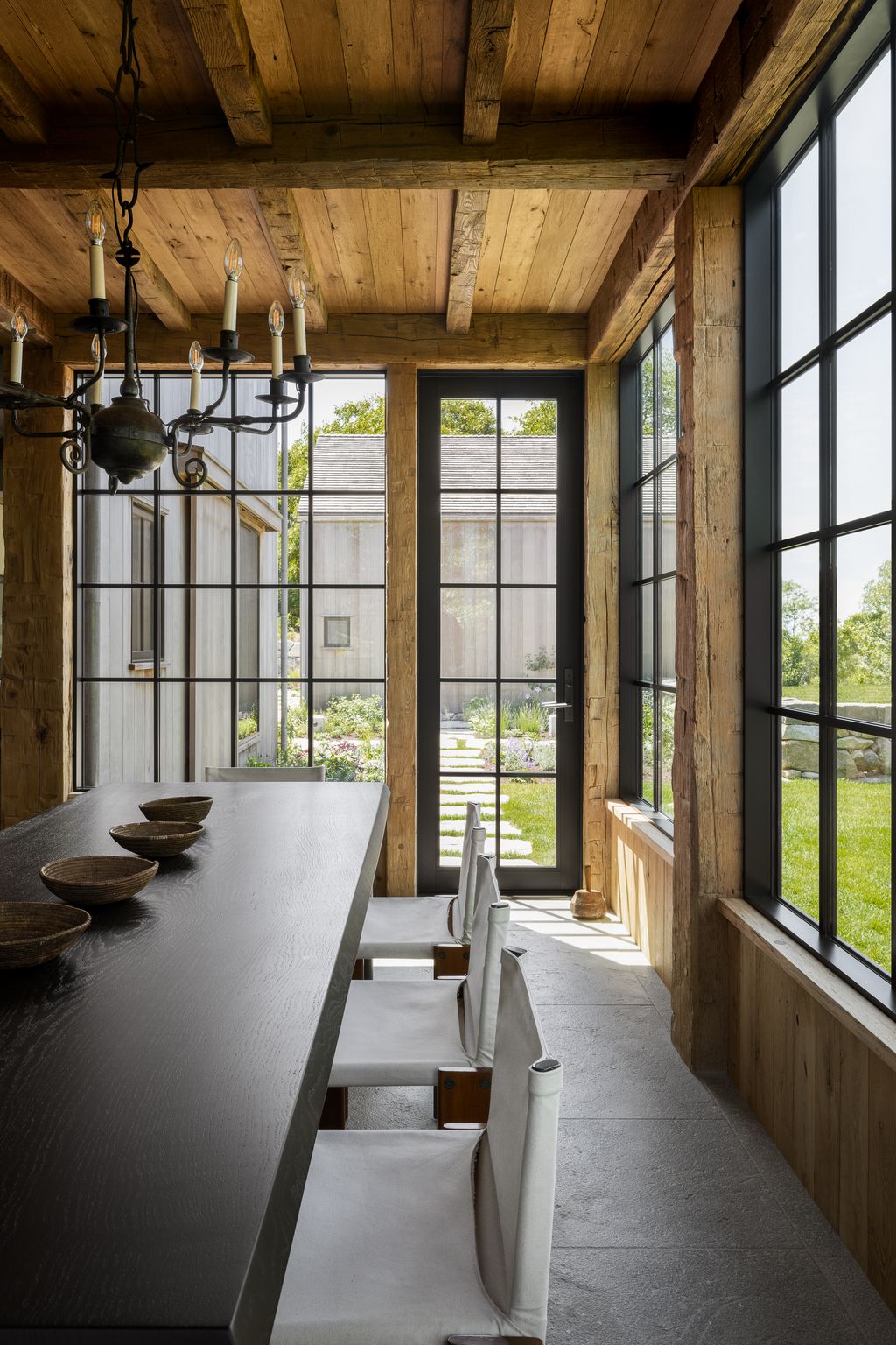 Image may contain Indoors Interior Design Architecture Building Dining Room Dining Table Furniture Room and Table