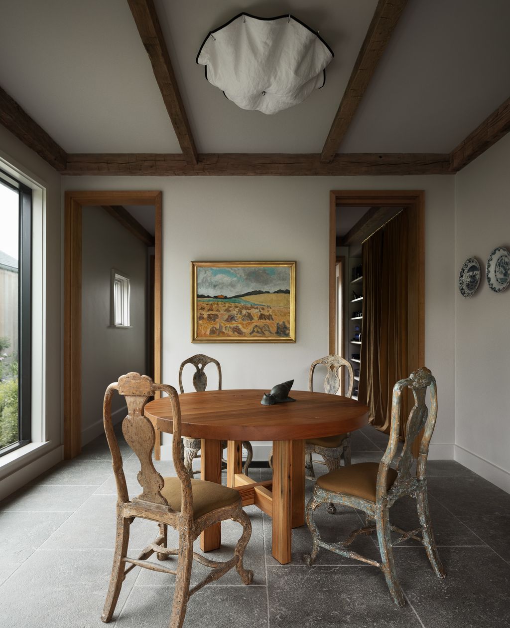 Image may contain Architecture Building Dining Room Dining Table Furniture Indoors Room Table Desk Chair and Art