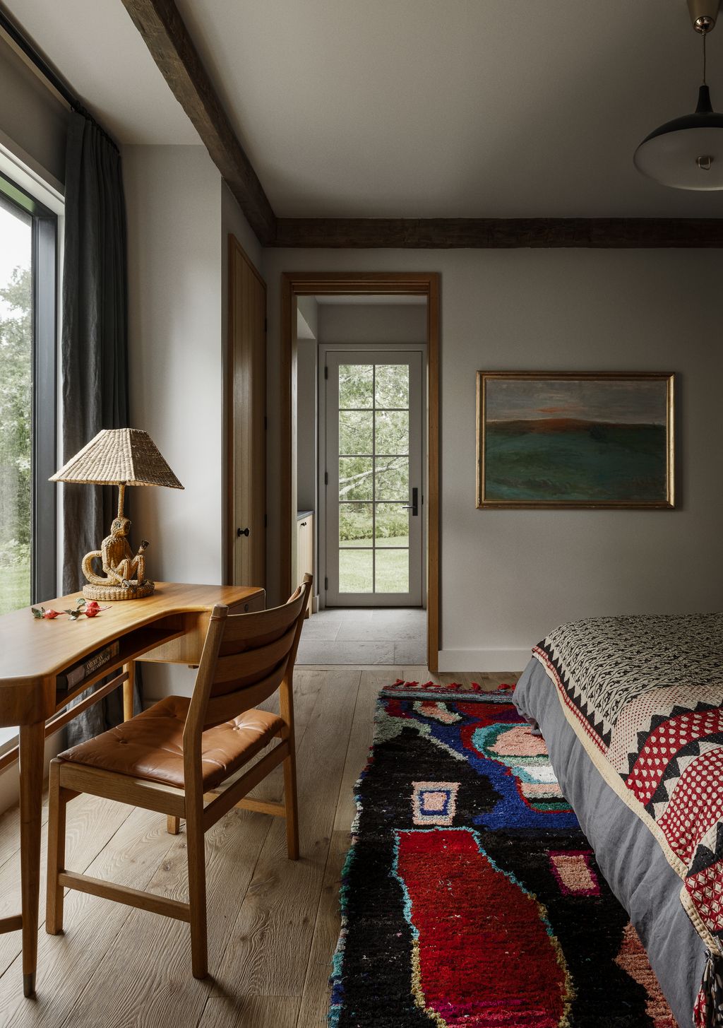 Image may contain Home Decor Lamp Chair Furniture Art Painting Rug Indoors Interior Design Corner and Bed