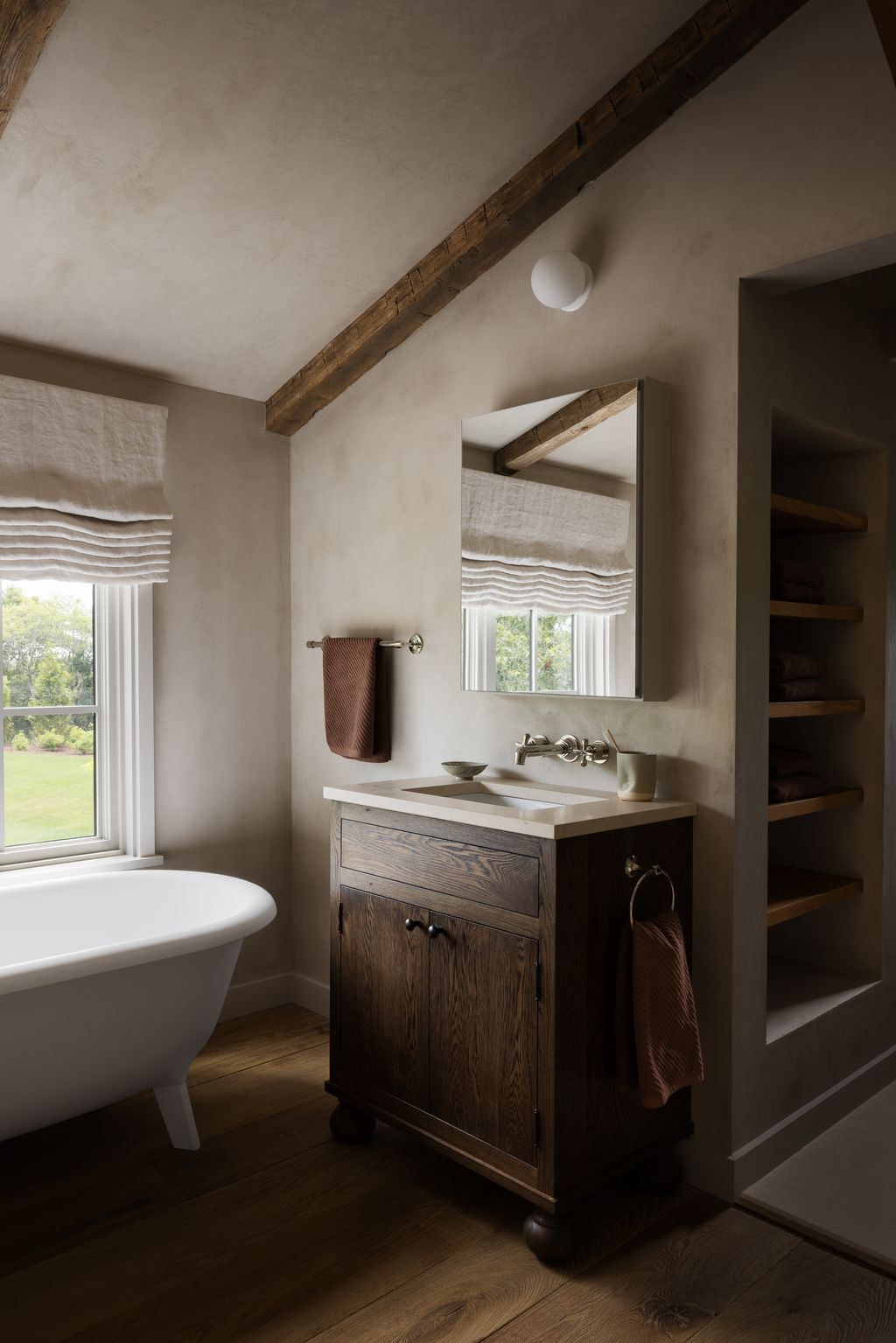 Image may contain Corner Indoors Interior Design Bathing Bathtub Person Tub Lamp Sink Sink Faucet Cup and Wood