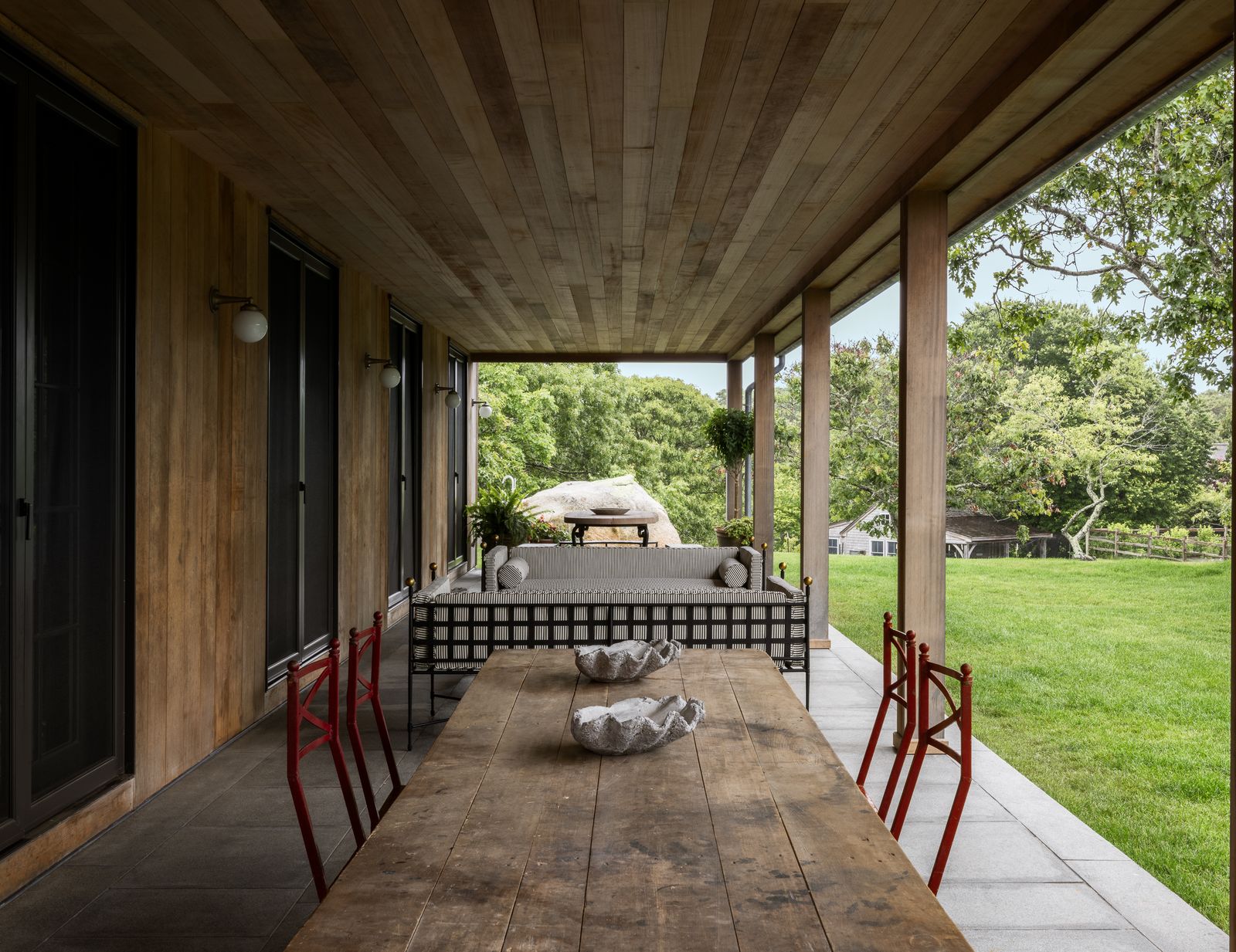 Image may contain Indoors Interior Design Architecture Building House Housing Porch Desk Furniture Table and Lamp