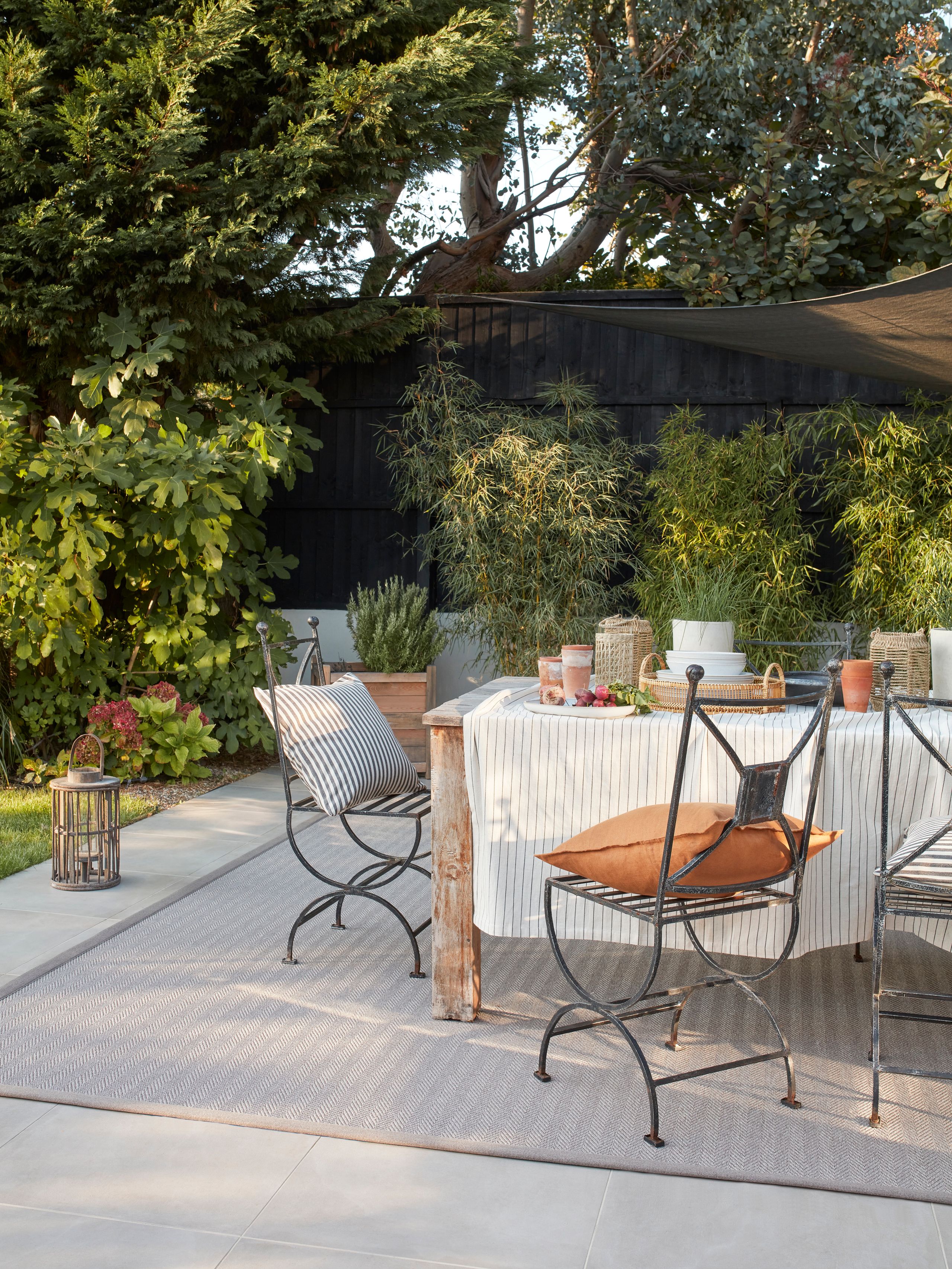 Image may contain: Indoors, Interior Design, Backyard, Nature, Outdoors, Yard, Chair, Furniture, Plant, and Architecture