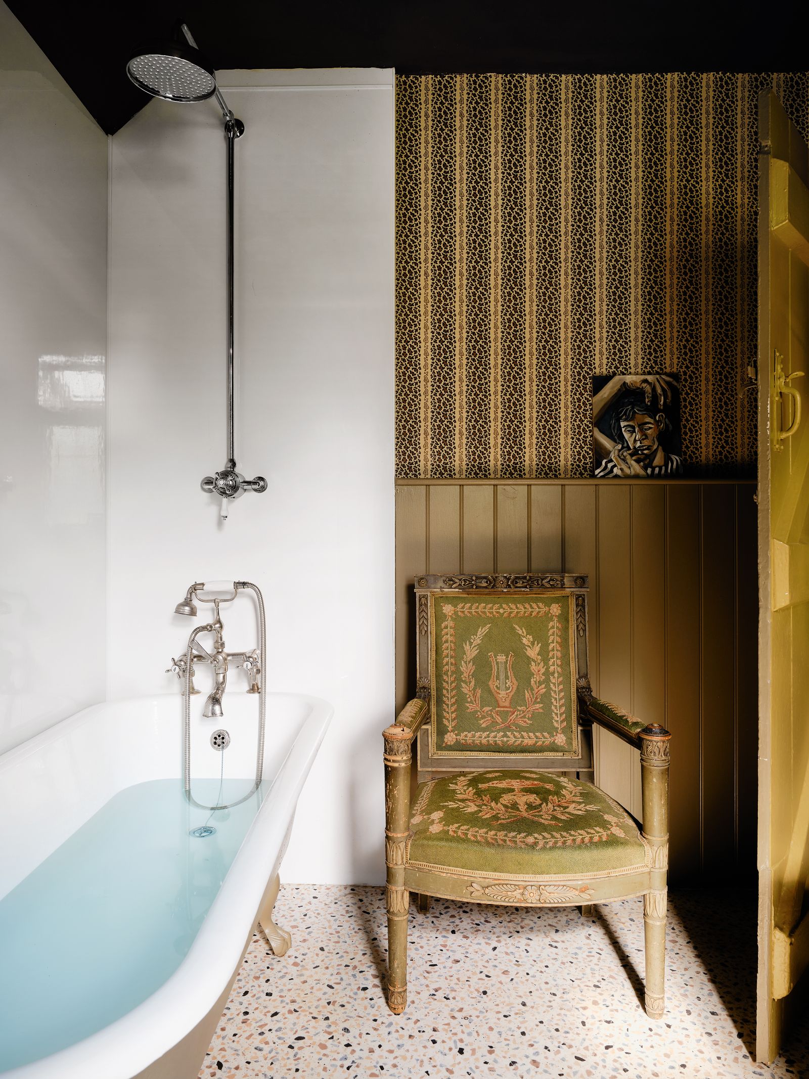Image may contain Indoors Interior Design Chair Furniture Bathing Bathtub Person Tub Bathroom and Room