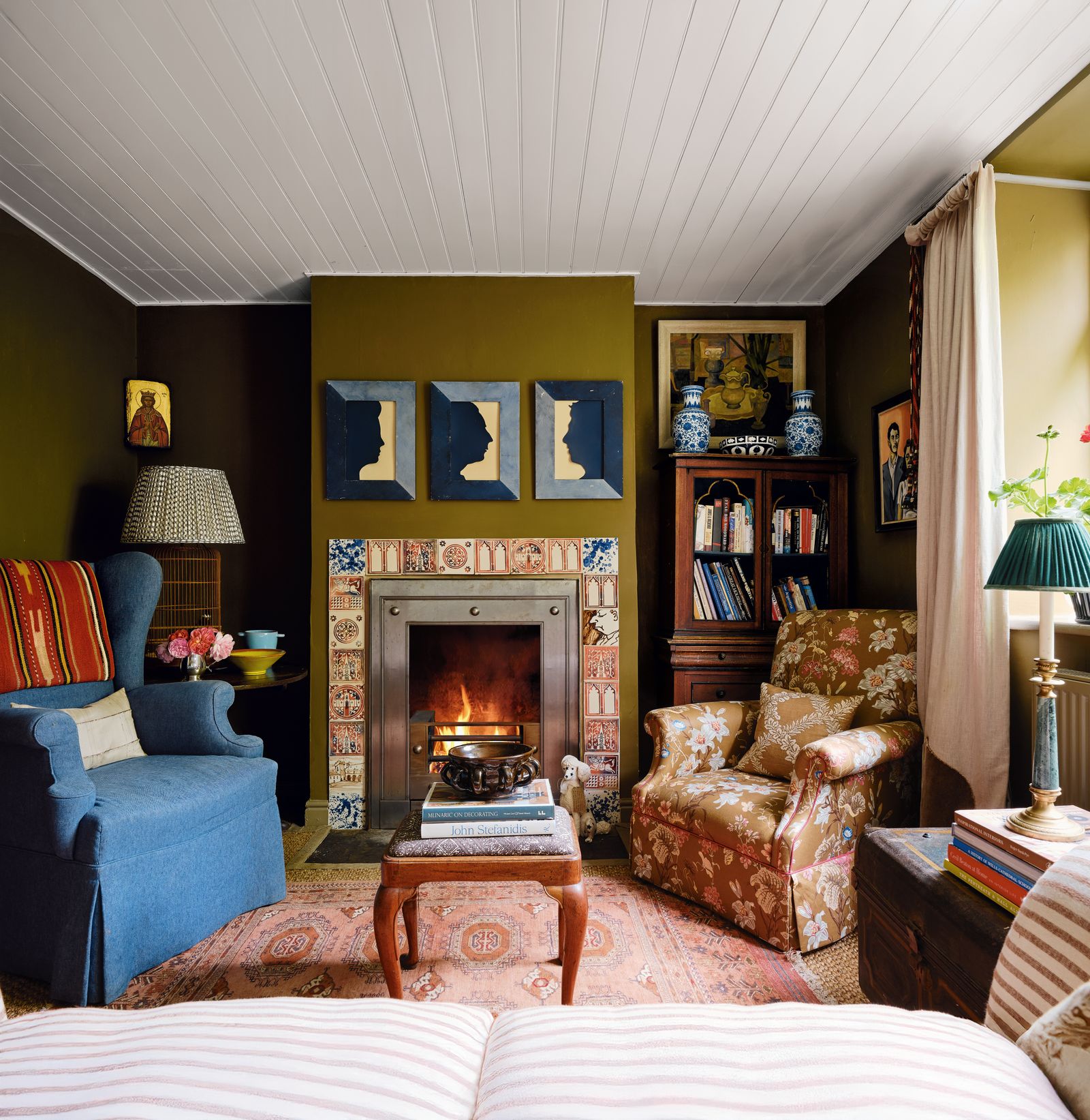 Image may contain Home Decor Lamp Fireplace Indoors Couch Furniture Art Painting Interior Design and Architecture