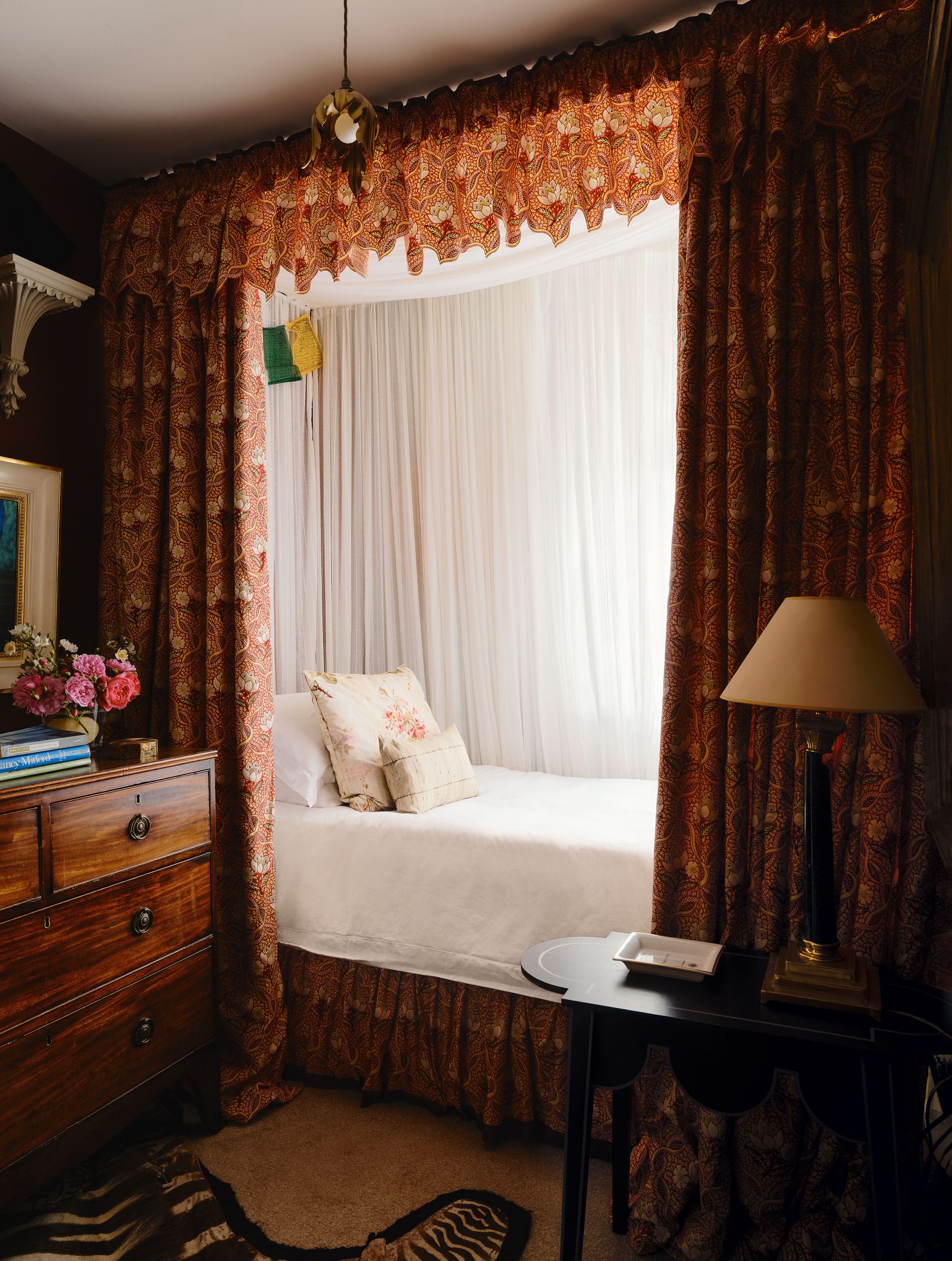 Image may contain Lamp Furniture Indoors Bed Bedroom Room Desk Table and Interior Design