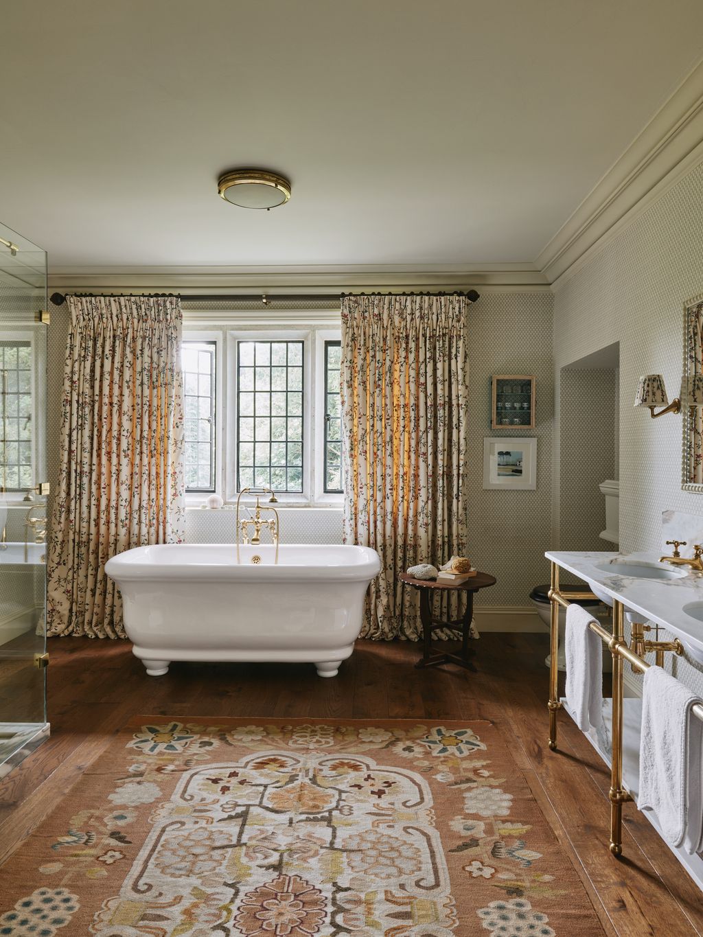 Image may contain Bathing Home Decor Desk Furniture Table Lamp Bathtub Person Tub Rug Art Painting and Sink