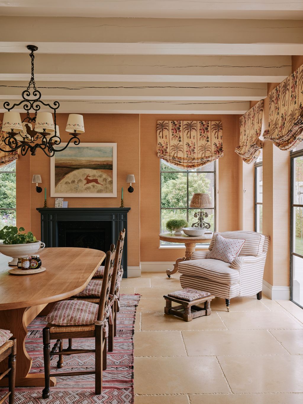 Image may contain Lamp Home Decor Chandelier Furniture Table Plant Architecture Building and Dining Room