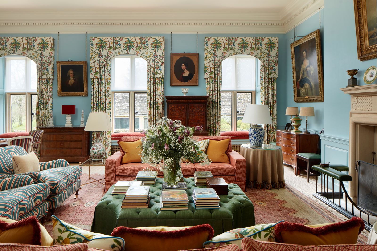 Image may contain Home Decor Lamp Art Painting Couch Furniture Desk Table Architecture Building and Indoors