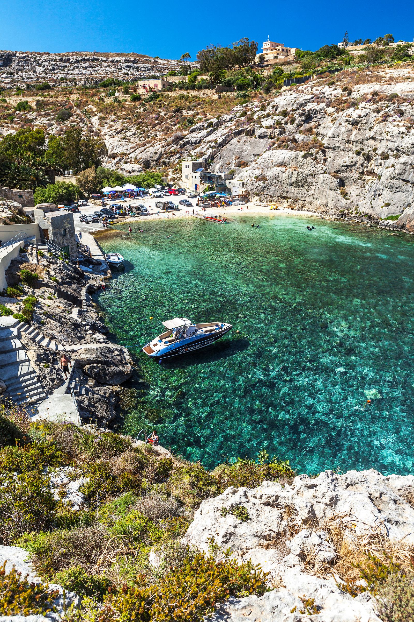 Image may contain Nature Outdoors Sea Water Rock Boat Transportation Vehicle Lagoon Lake Shoreline and Coast