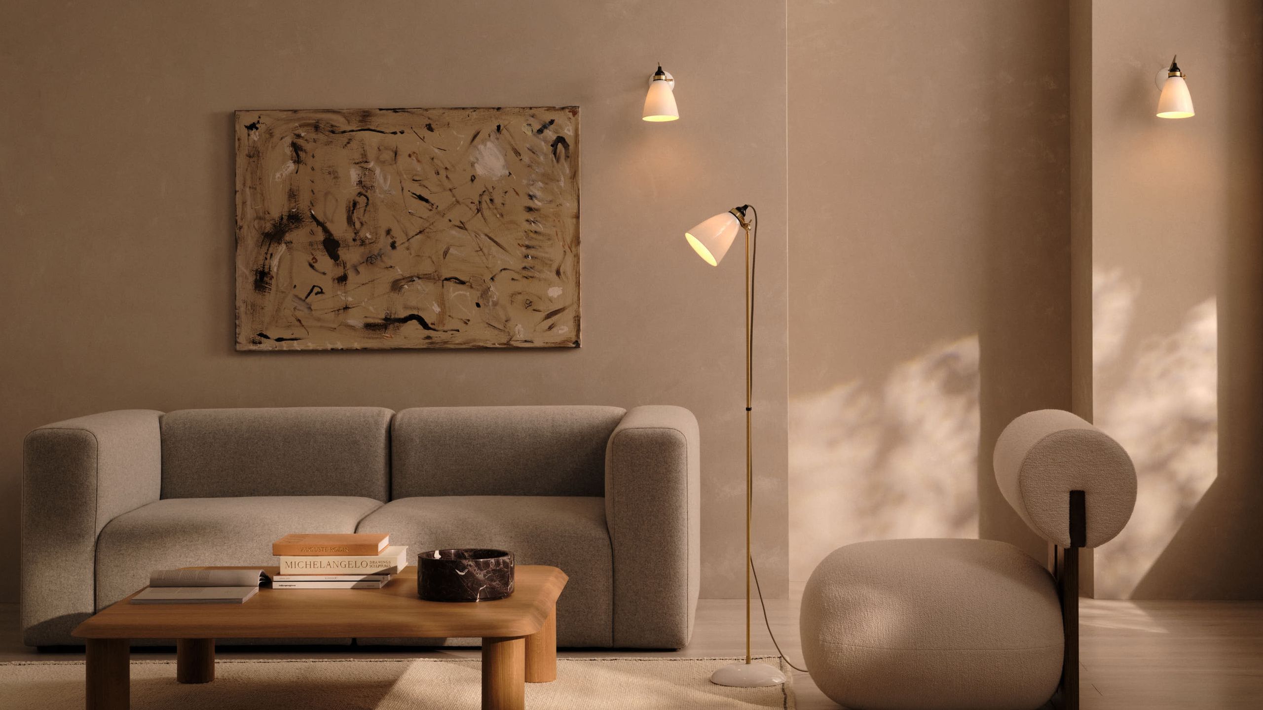 Image may contain: Lamp, Architecture, Building, Furniture, Indoors, Living Room, Room, Couch, Book, Publication, and Table