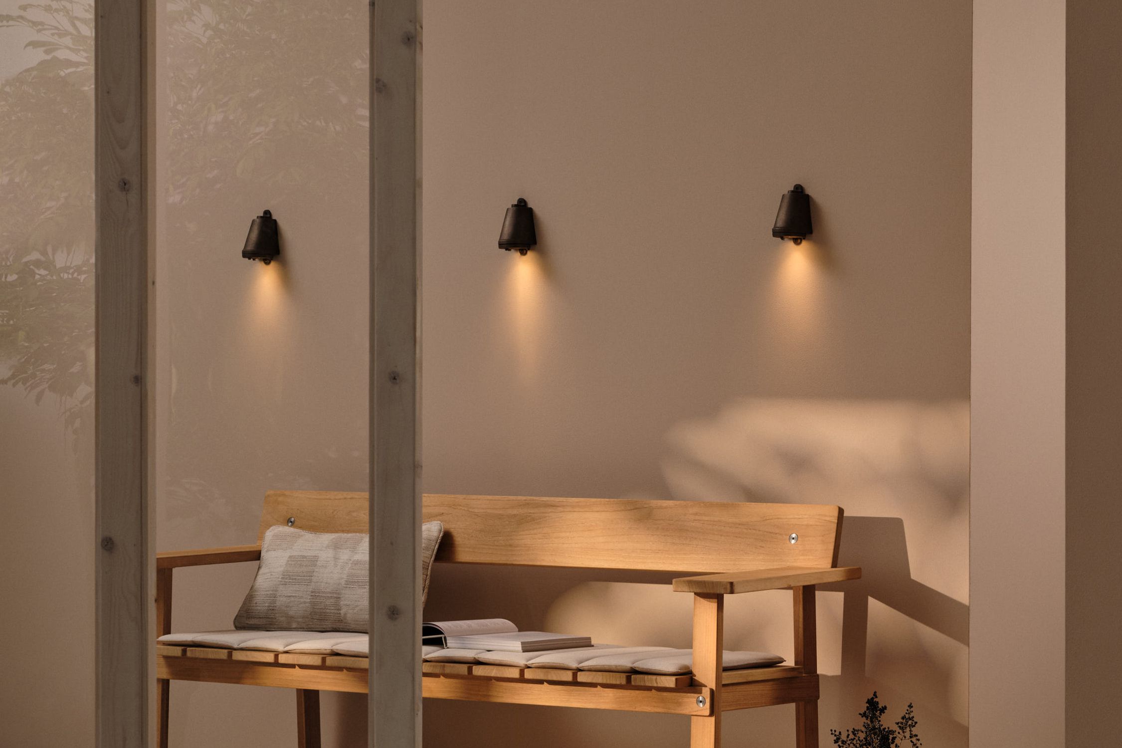 Image may contain: Lighting, Lamp, Indoors, Interior Design, Furniture, Table, Book, Publication, Bed, and Wood