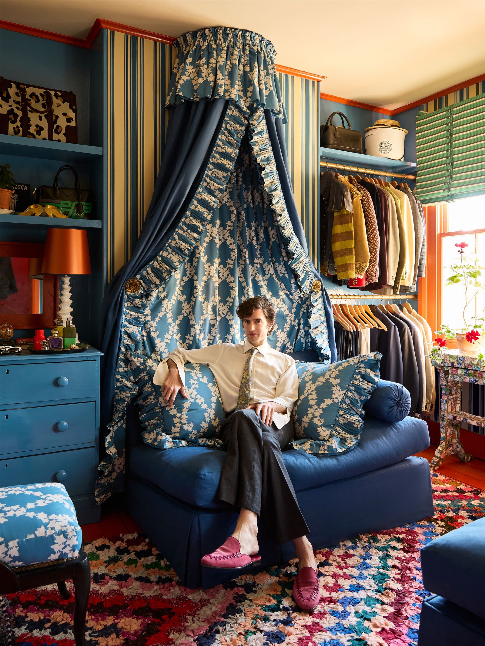 Image may contain Tom Dey Furniture Accessories Bag Handbag Indoors Person Formal Wear Tie Lamp and Clothing