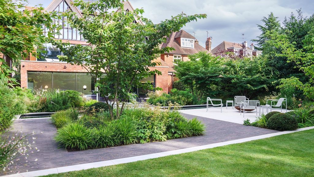 Image may contain Grass Plant Backyard Nature Outdoors Yard Garden Architecture Building Housing Lawn and Chair