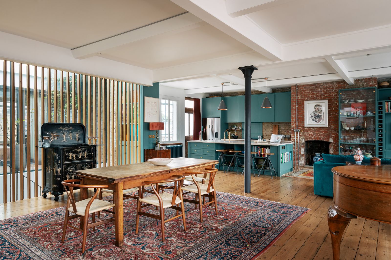 Image may contain Architecture Building Dining Room Dining Table Furniture Indoors Room Table Home Decor and Rug