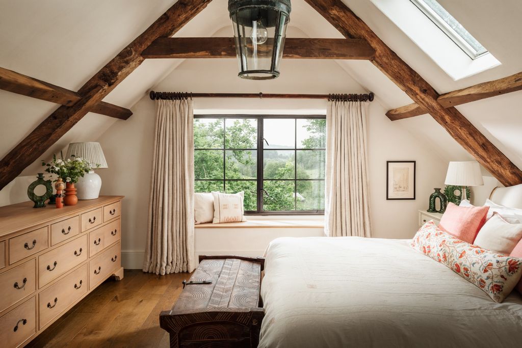 Image may contain Architecture Building House Housing Indoors Loft Room Lamp Interior Design Bed and Furniture