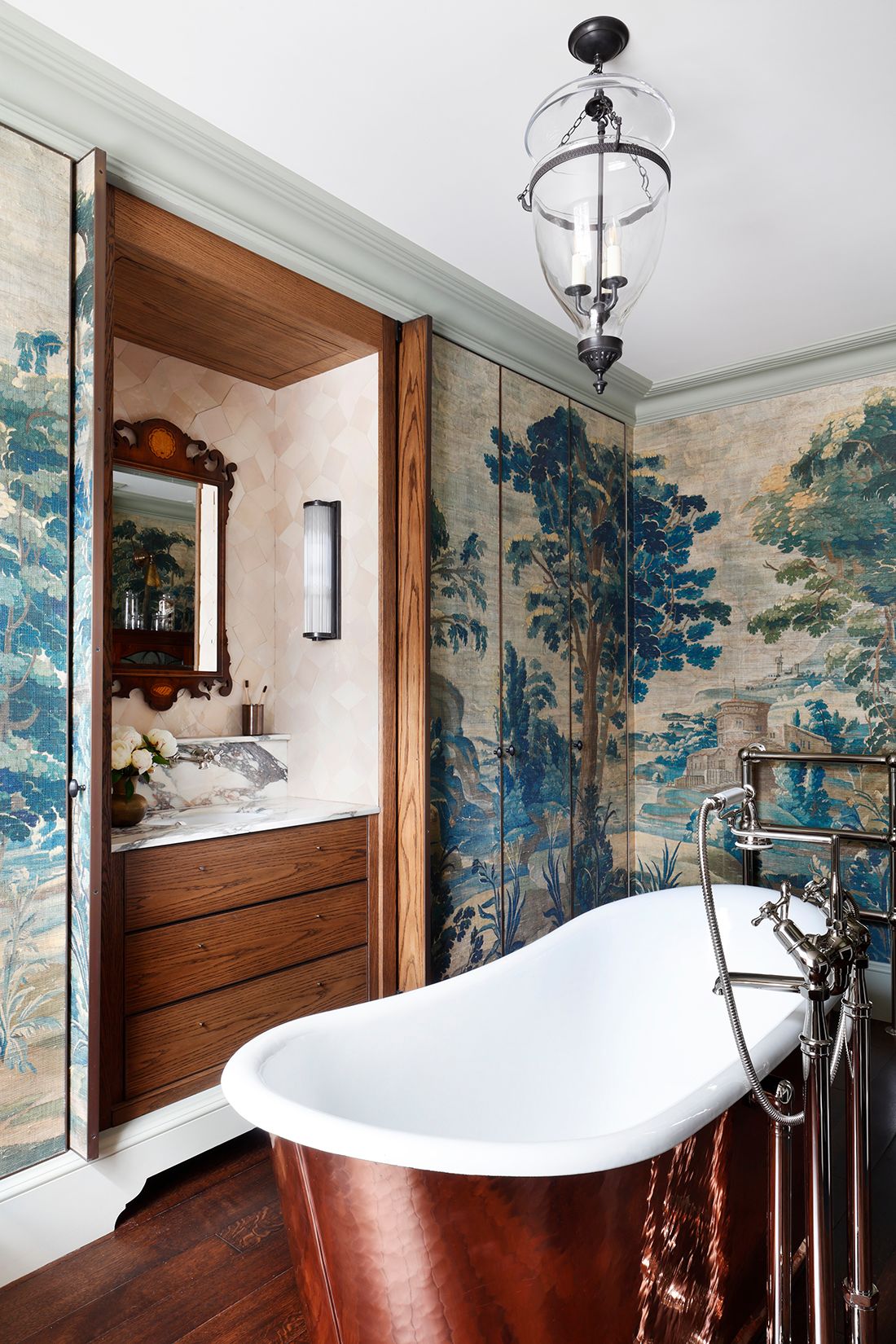 Image may contain Indoors Interior Design Bathing Lamp Bathtub Person Tub Cup and Chandelier