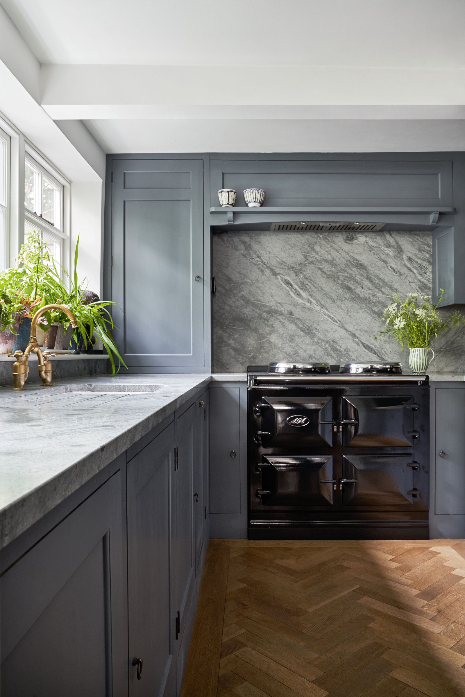 Image may contain Indoors Interior Design Kitchen Plant Floor Sink and Sink Faucet