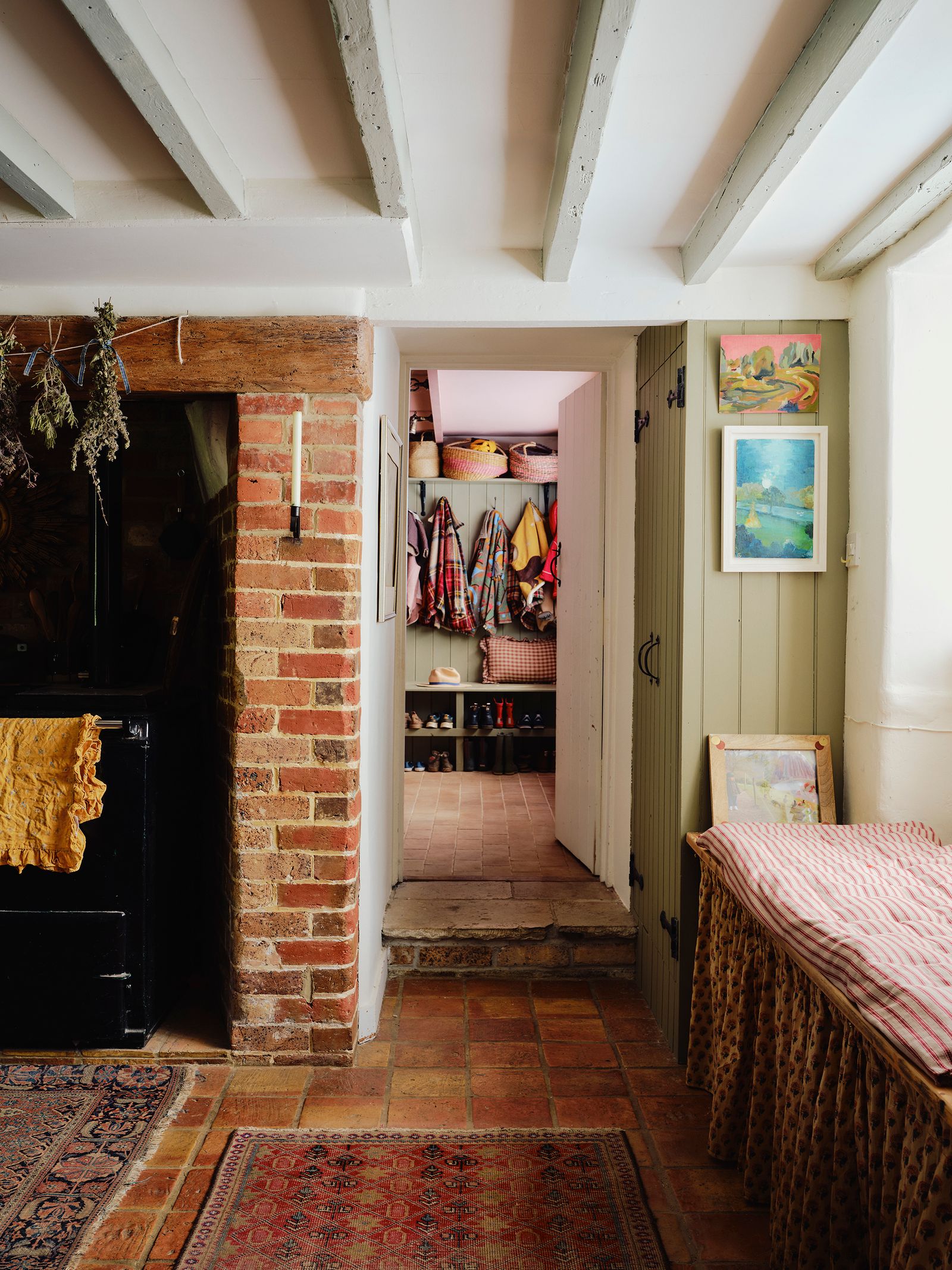 Image may contain Floor Home Decor Rug Art Painting Dressing Room Indoors Room Bed Furniture Accessories and Bag