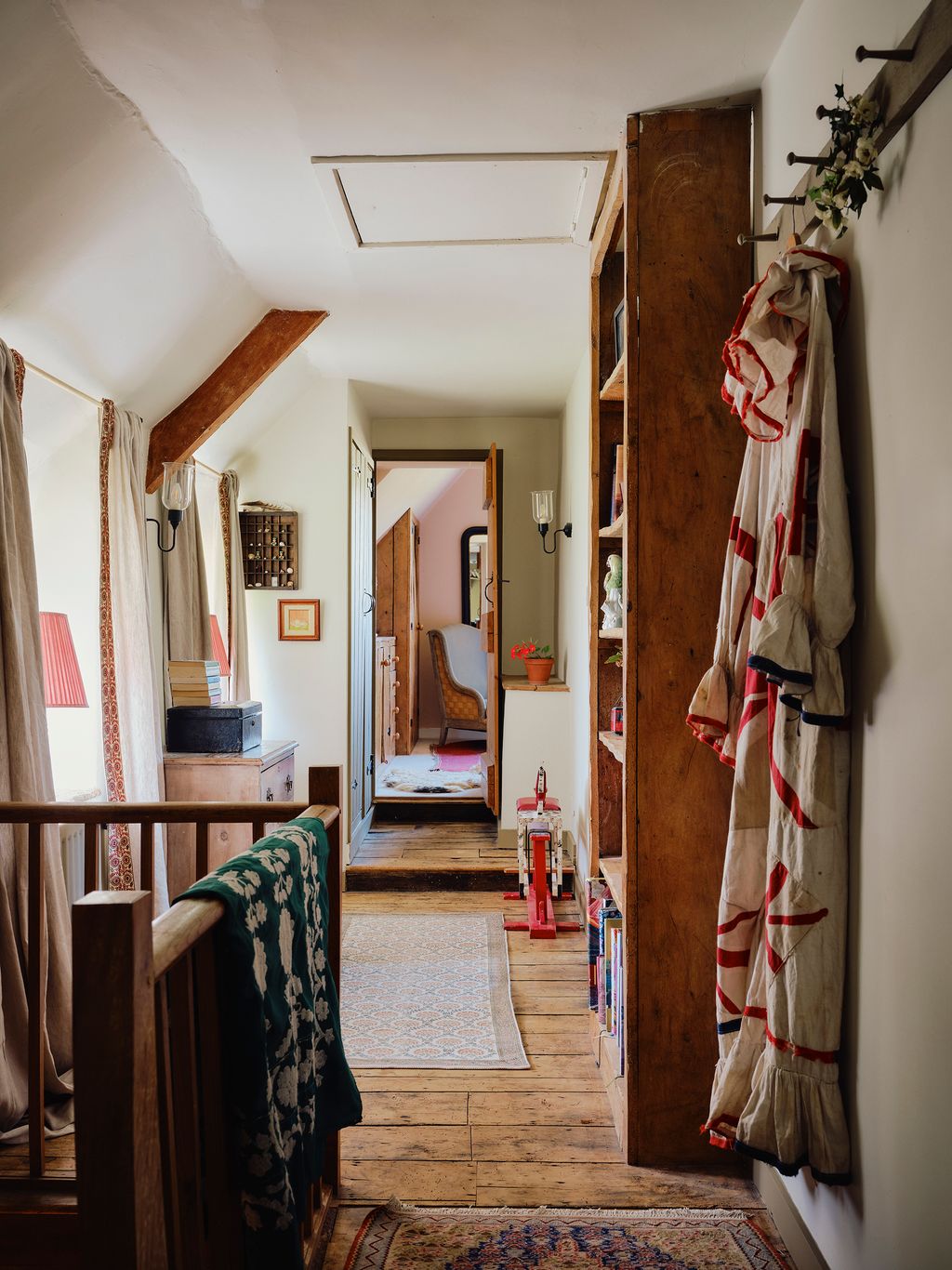 Image may contain Indoors Interior Design Lamp Home Decor Rug Chair Furniture Art Painting Floor Box and Plant