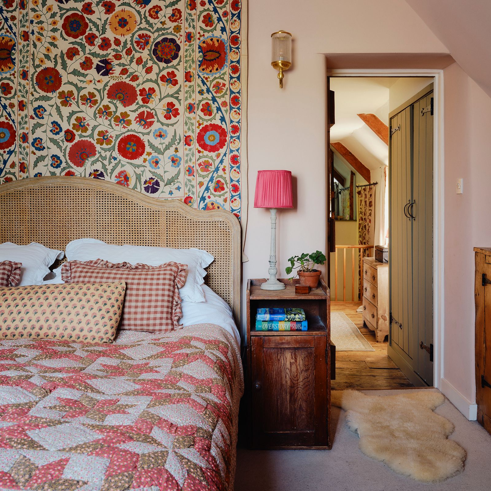 Image may contain Home Decor Lamp Indoors Interior Design Plant Bed Furniture Rug Cushion Bedroom and Room