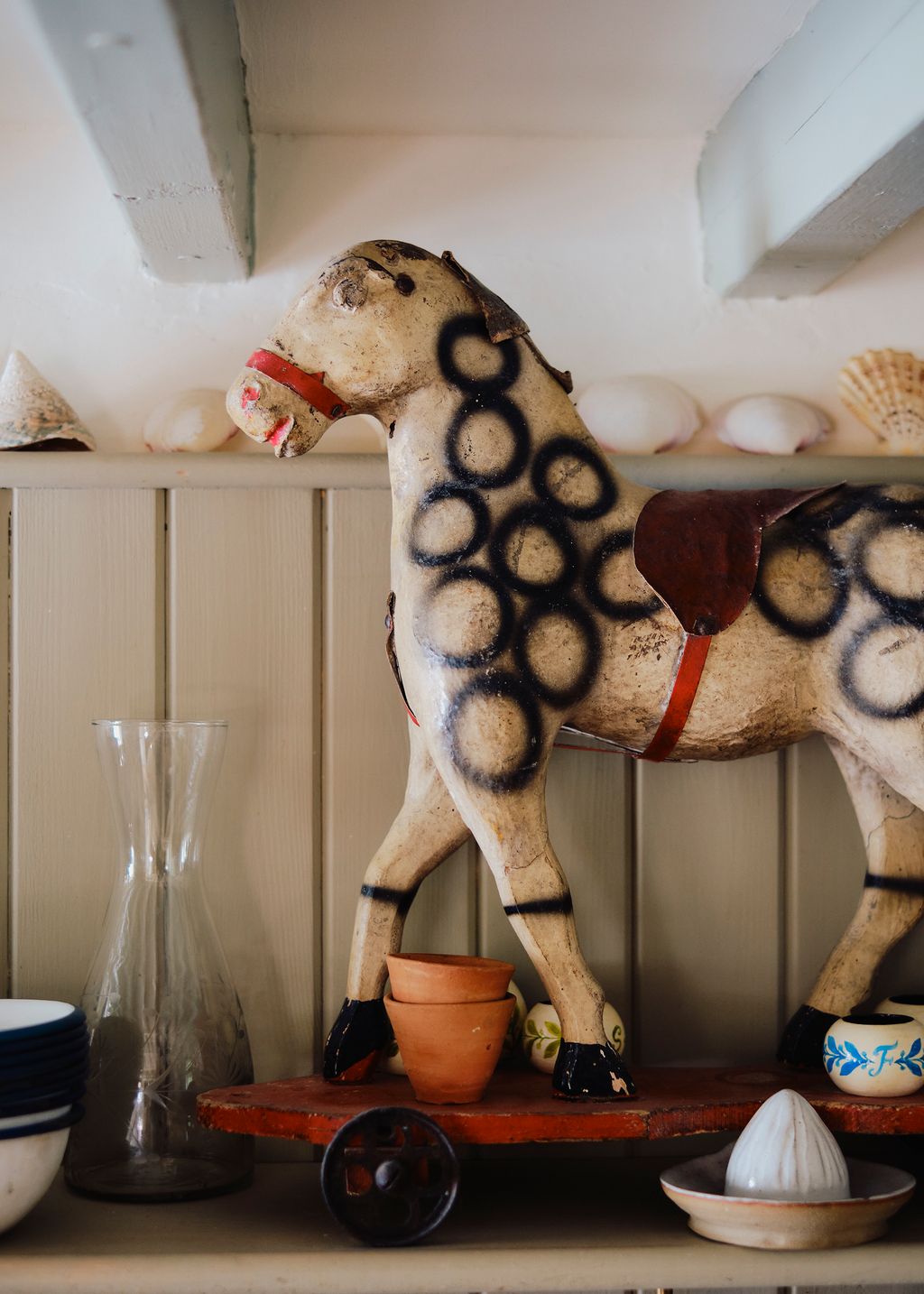 Image may contain Pottery Indoors Interior Design Wood Jar Vase Art Porcelain Animal Horse Mammal Bread and Food