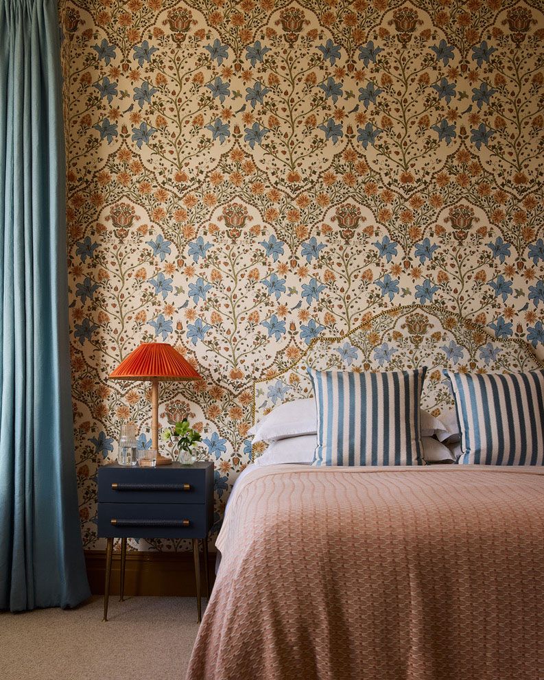 Image may contain: Indoors, Interior Design, Lamp, Home Decor, Bed, Furniture, Cushion, Plant, Bedroom, Room, and Cup