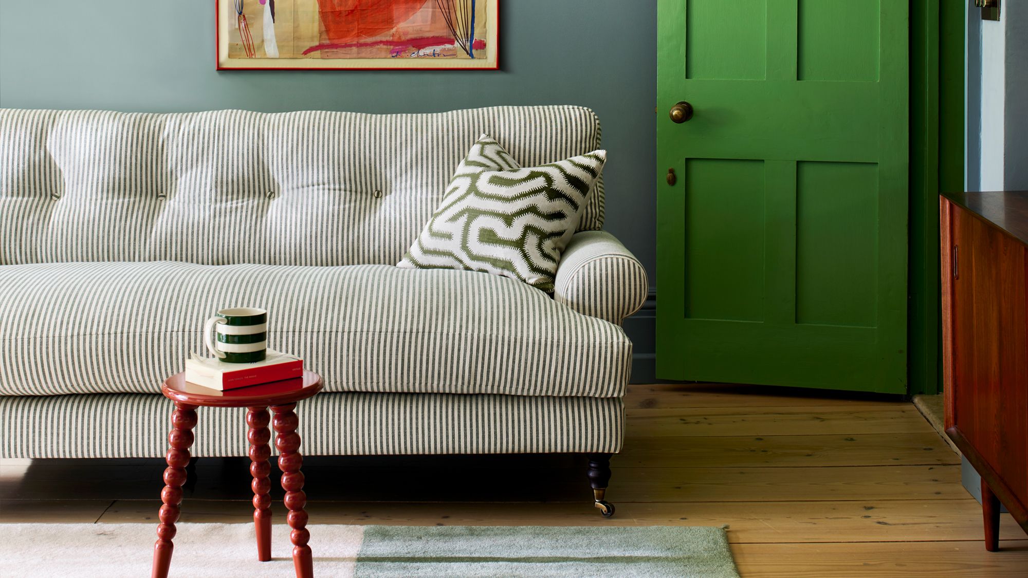 Image may contain: Couch, Furniture, Home Decor, Cushion, Indoors, Interior Design, Cup, Architecture, and Building