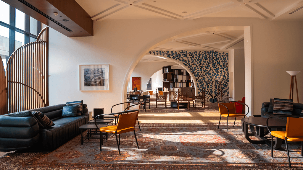 Image may contain Architecture Building Furniture Indoors Living Room Room Floor Flooring Couch and Interior Design