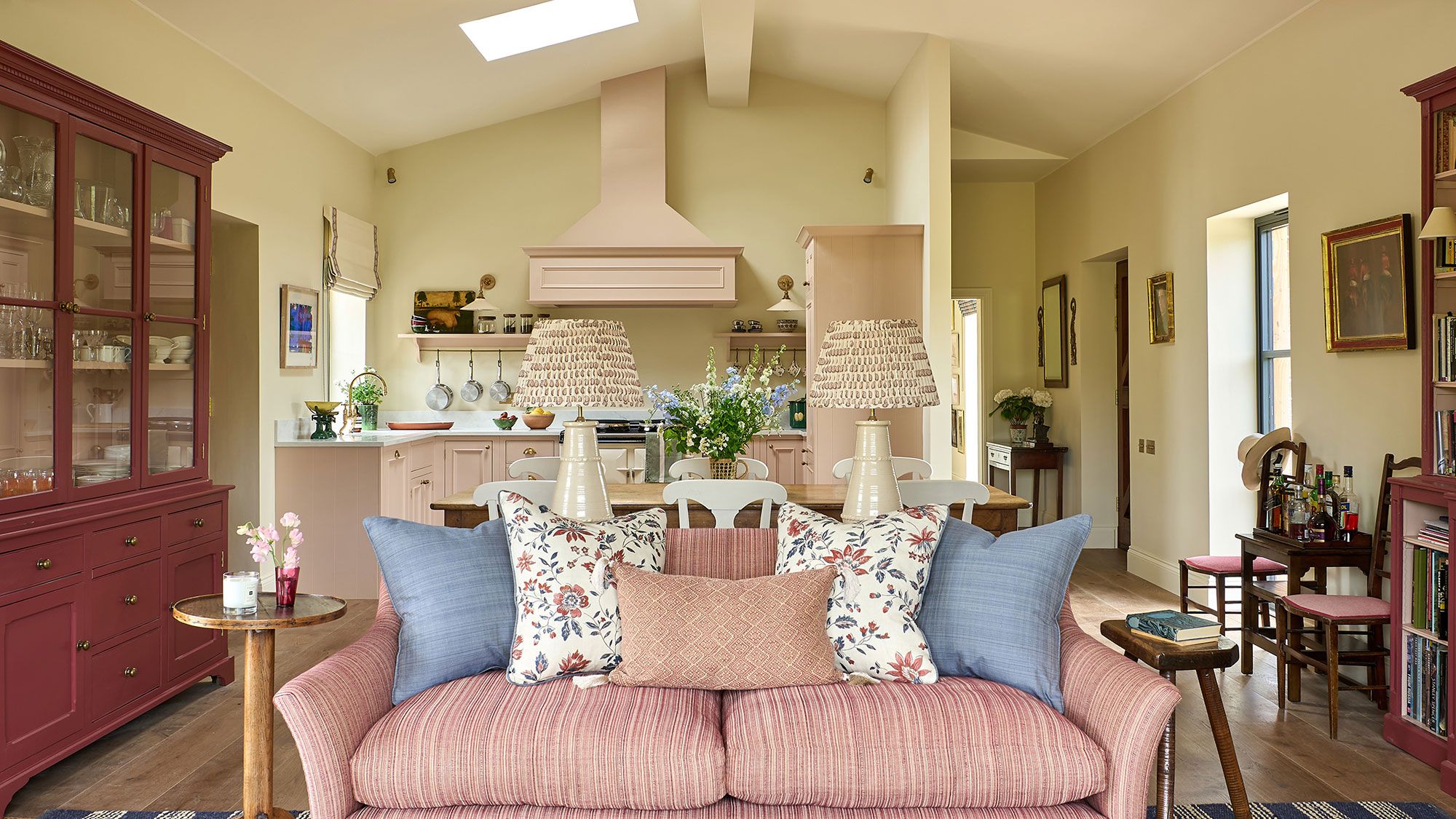 Image may contain: Home Decor, Cushion, Couch, Furniture, Art, Painting, Lamp, Architecture, Building, and Dining Room