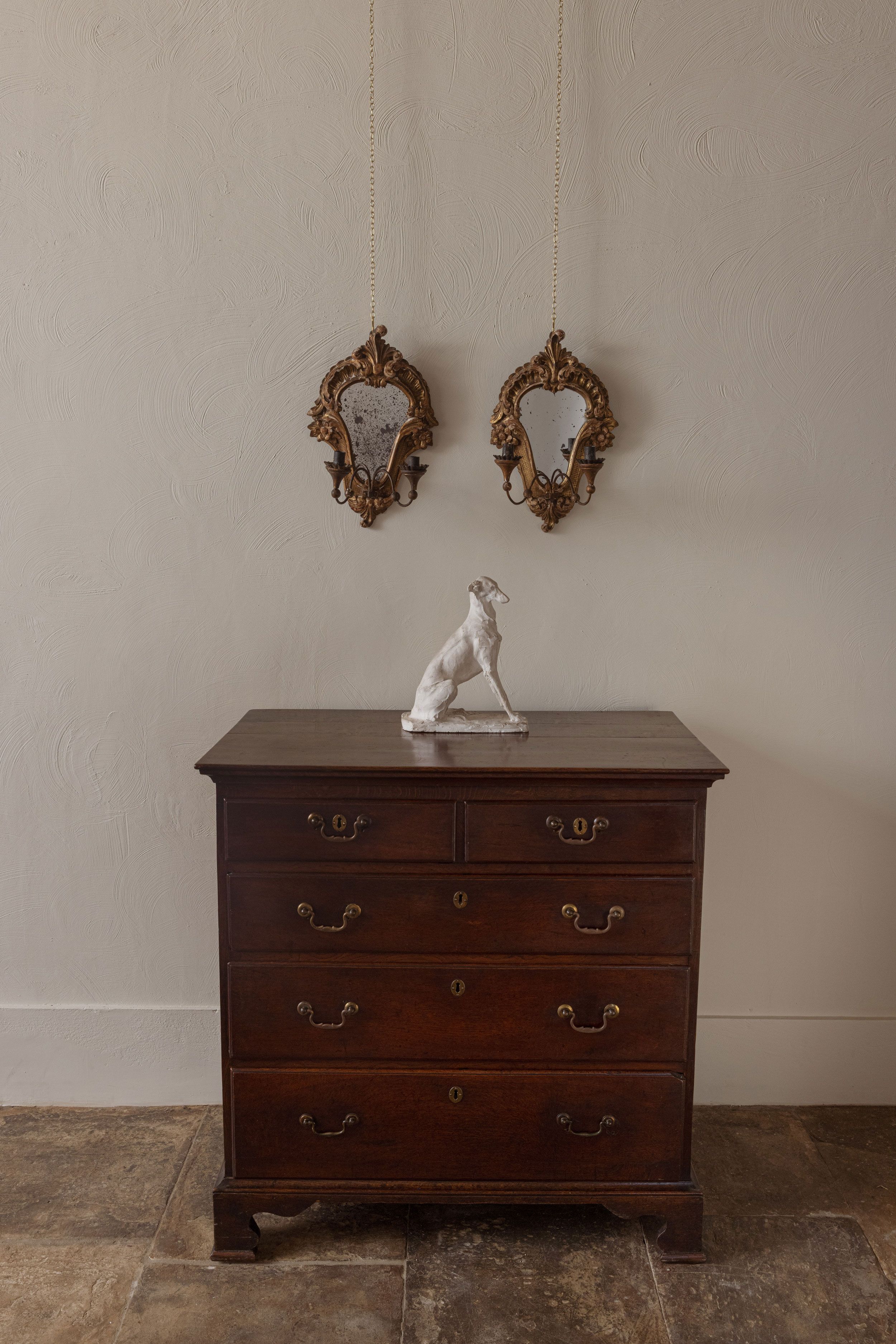 Image may contain: Furniture, Animal, Canine, Dog, Mammal, Pet, and Chest Of Drawers