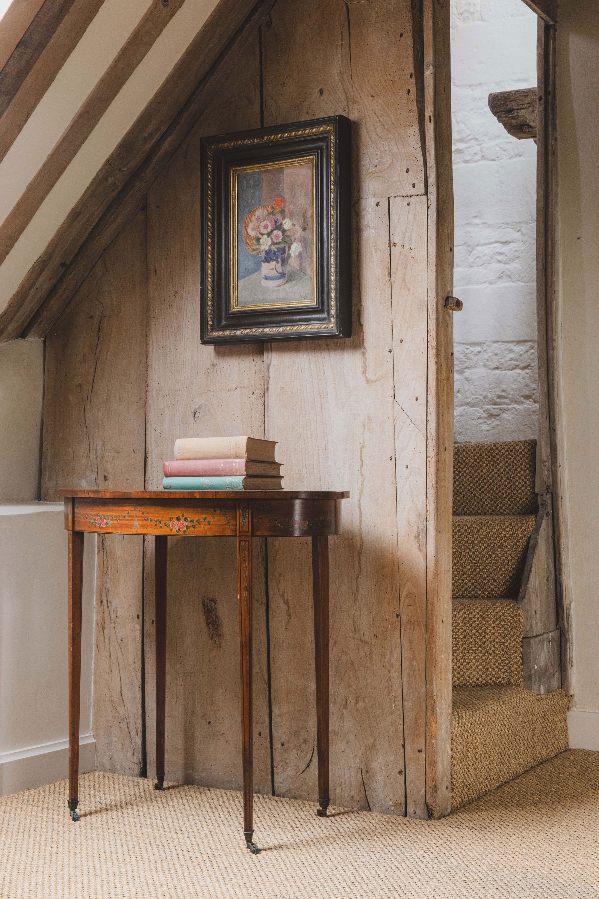 Image may contain: Corner, Indoors, Interior Design, Wood, Art, Painting, Furniture, Table, Desk, Architecture, and Building