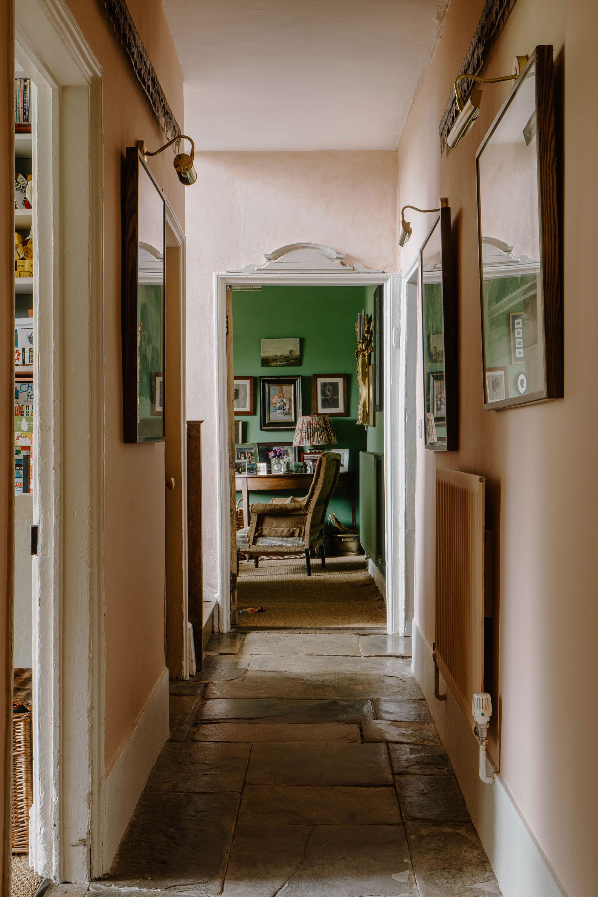 Image may contain: Floor, Flooring, Chair, Furniture, Lamp, Art, Painting, Indoors, Hallway, Interior Design, and Plant