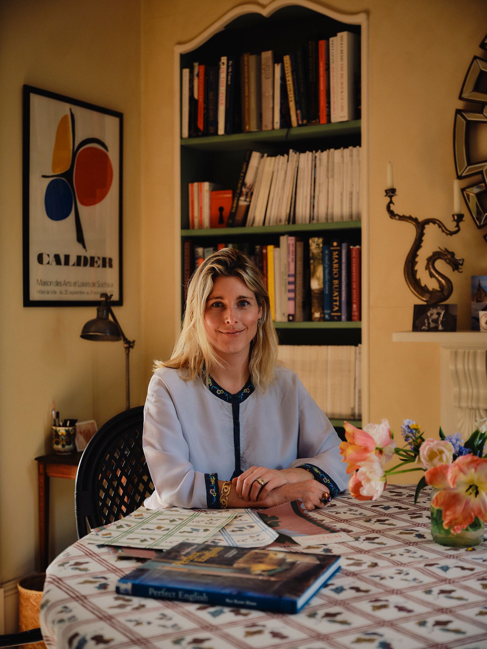 Image may contain Vicki MovsessianLamoriello Lamp Book Publication Face Head Person Photography Portrait and Desk