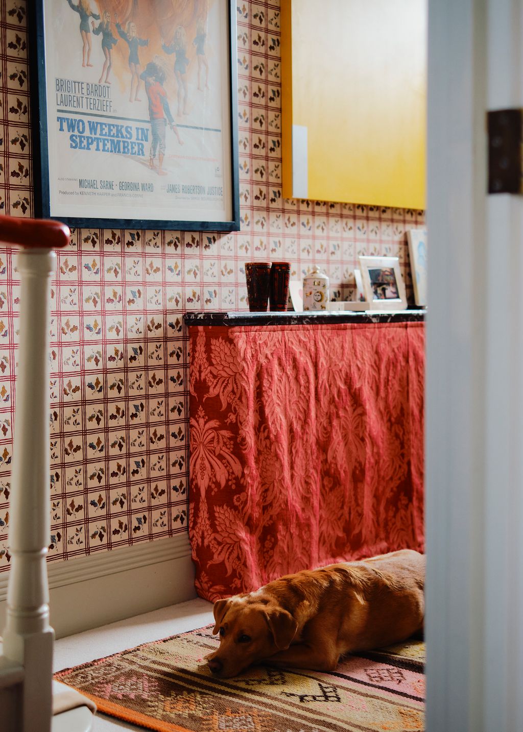 Image may contain Indoors Interior Design Home Decor Rug Animal Canine Dog Mammal Pet Cup Art and Painting