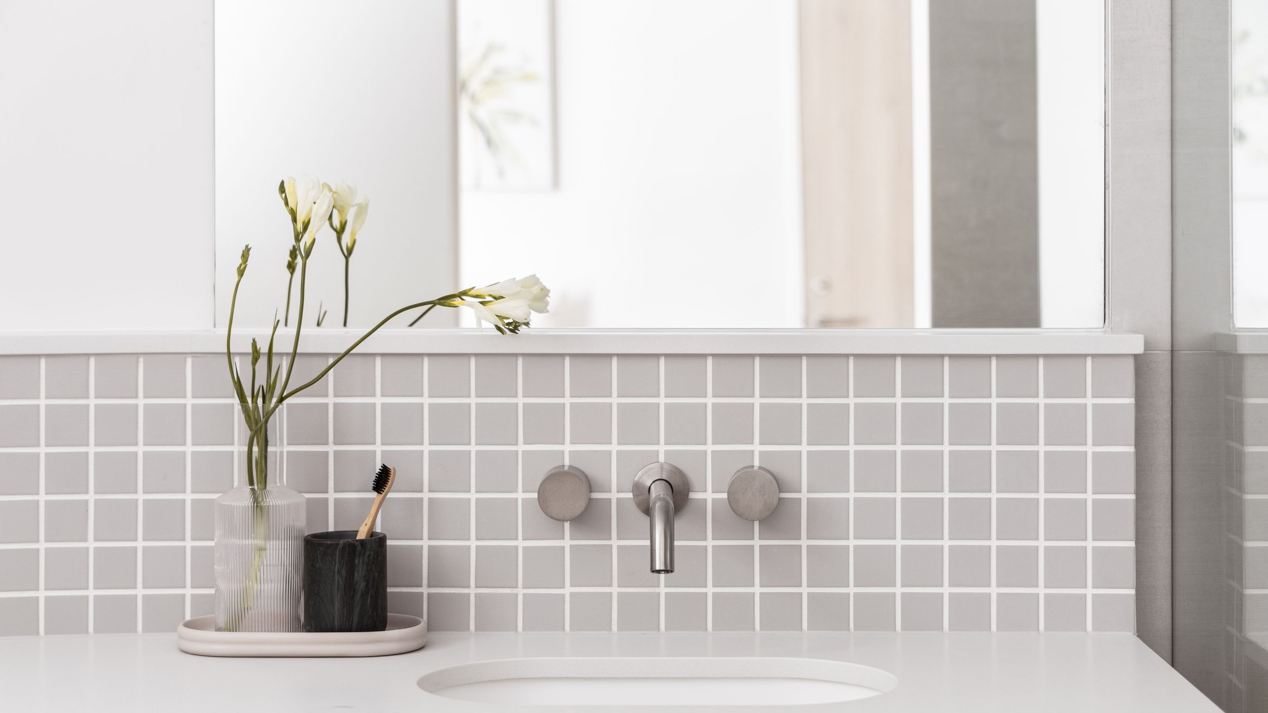 Image may contain: Brush, Device, Tool, Toothbrush, Sink, Flower, Flower Arrangement, Plant, and Sink Faucet