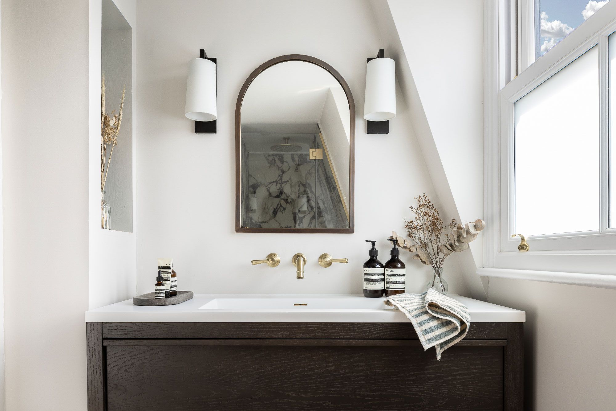 Image may contain: Lamp, Sink, Sink Faucet, Bathing, Bathtub, Person, Tub, Indoors, and Interior Design