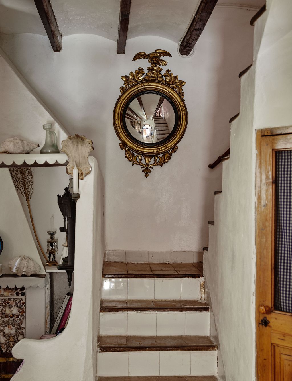 Image may contain Architecture Building House Housing Staircase Indoors Interior Design Foyer Candle and Person