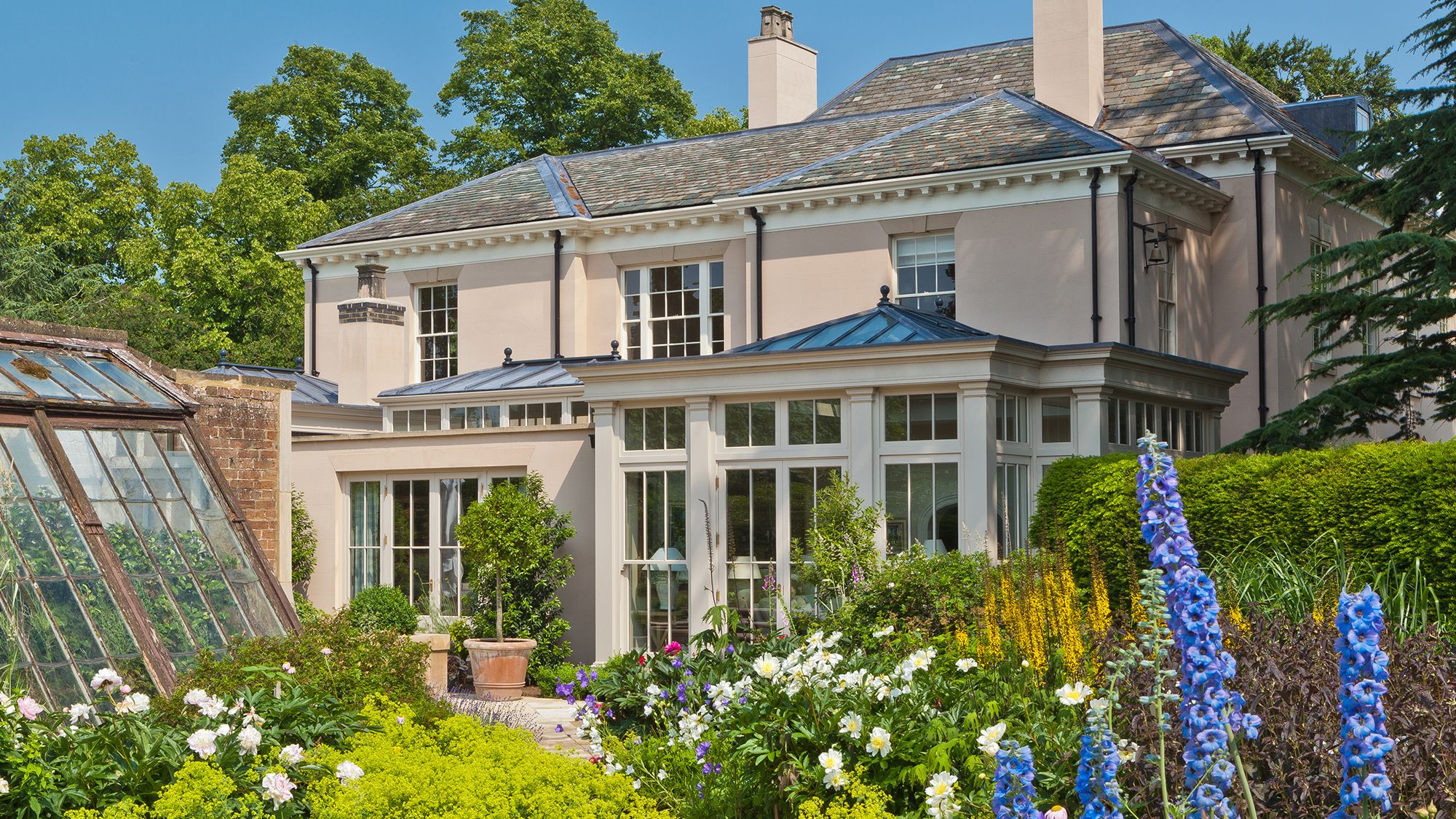 Image may contain: Plant, Garden, Nature, Outdoors, Architecture, Building, Housing, Cottage, House, Manor, and Window