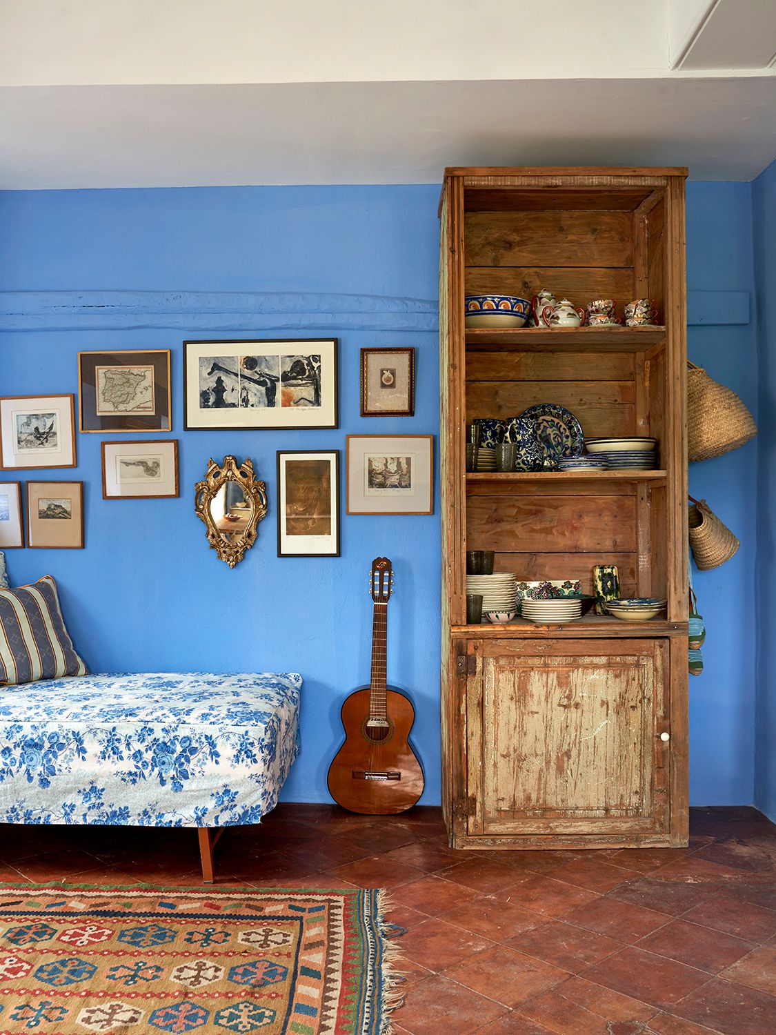 Image may contain Indoors Interior Design Home Decor Rug Guitar Musical Instrument Wood Bed Furniture and Art