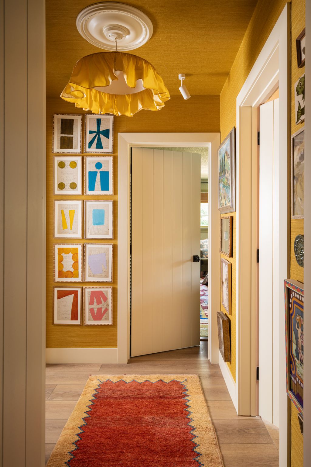 Image may contain Home Decor Rug Lamp Art Painting Indoors Interior Design Door Chandelier and Light Fixture