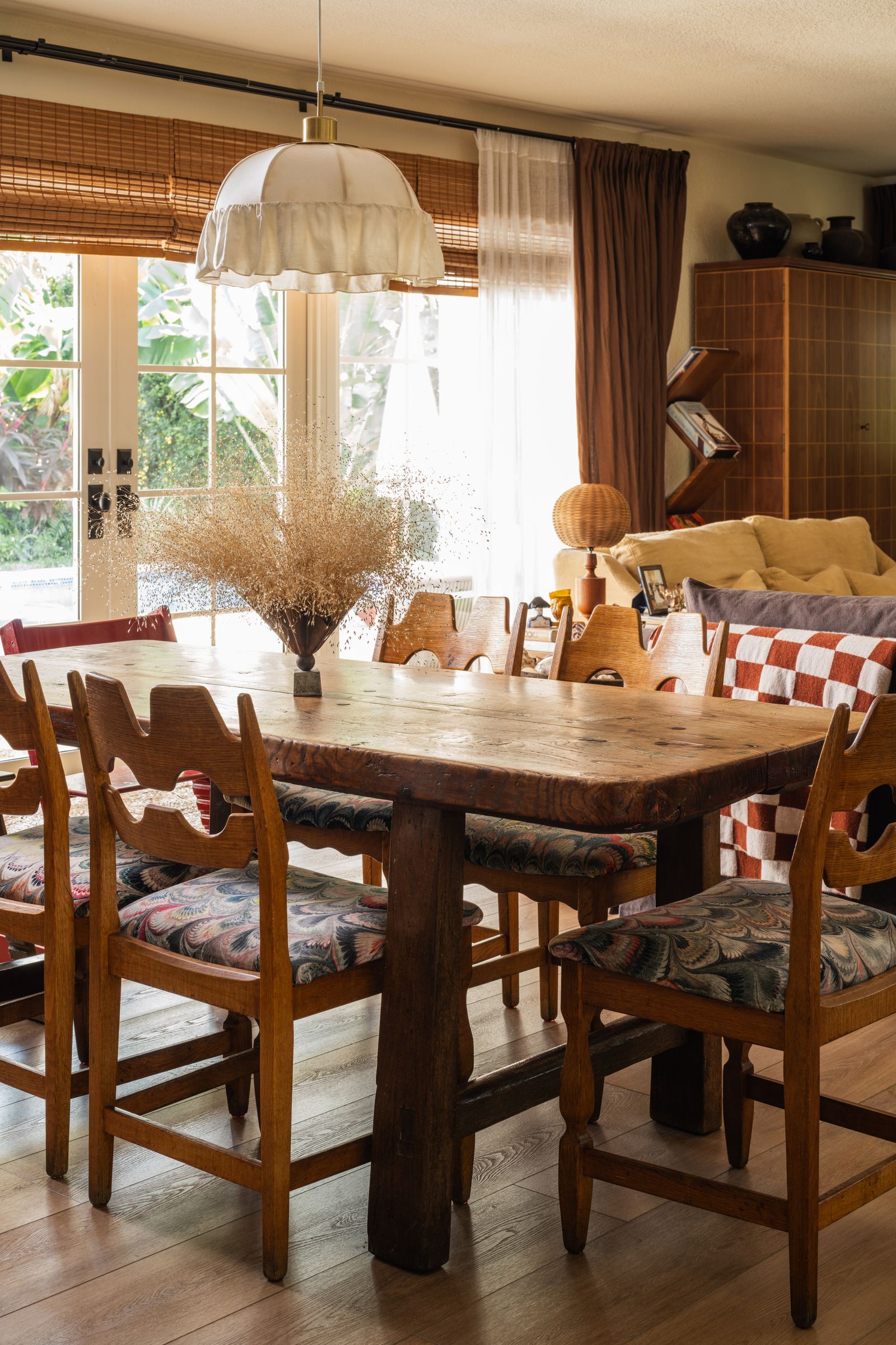 Image may contain Architecture Building Dining Room Dining Table Furniture Indoors Room Table Lamp and Chair