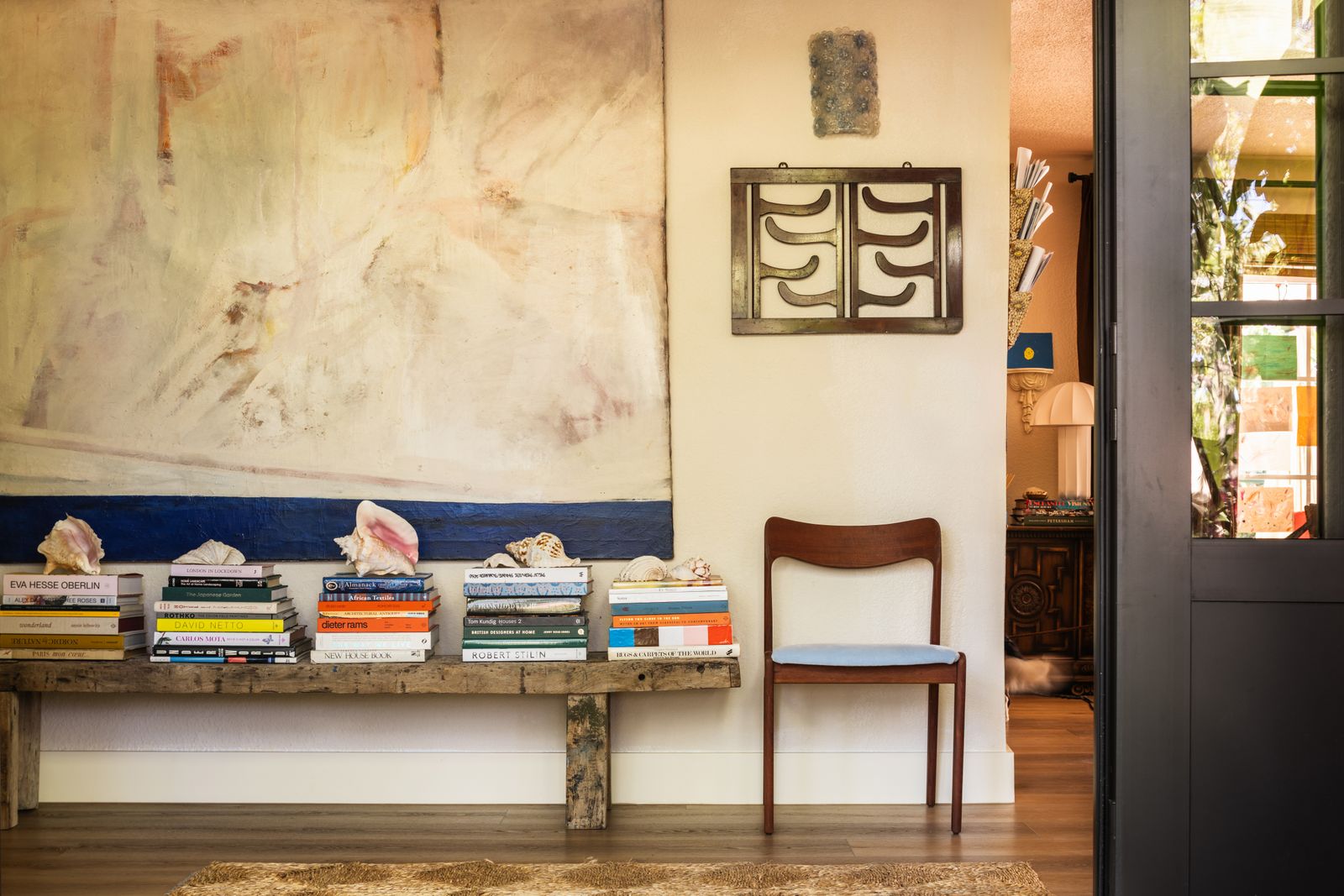 Image may contain Indoors Interior Design Chair Furniture Wood Table Plywood Bread Food Home Decor and Rug