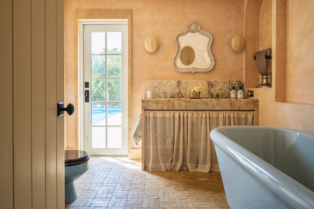 Image may contain Door Bathing Indoors Interior Design Bathtub Person Tub Bathroom Room Toilet and Architecture